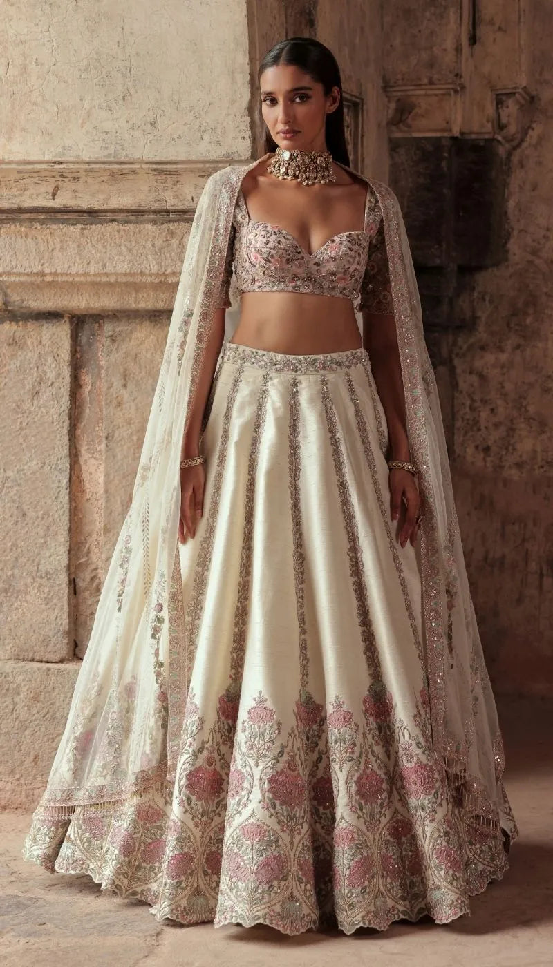 An Antique Ivory Panelled Raw silk Lehenga Set