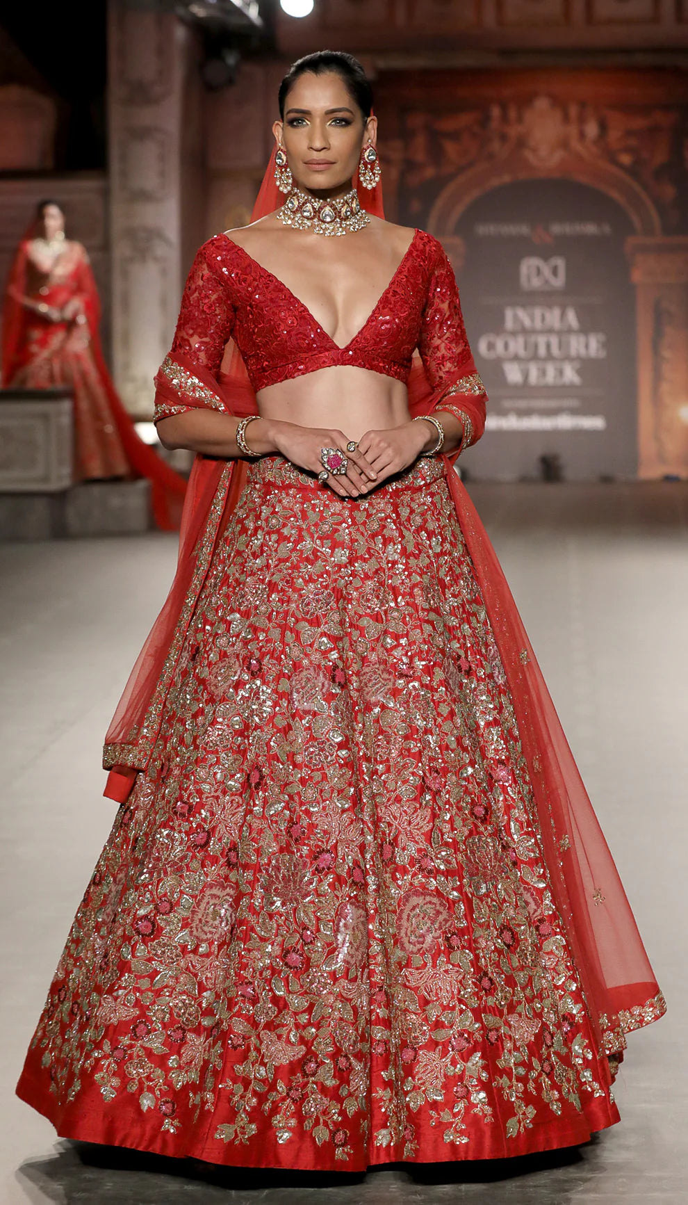 Model in The Deep Red Flower Cluster Lehenga by Shyamal & Bhumika.