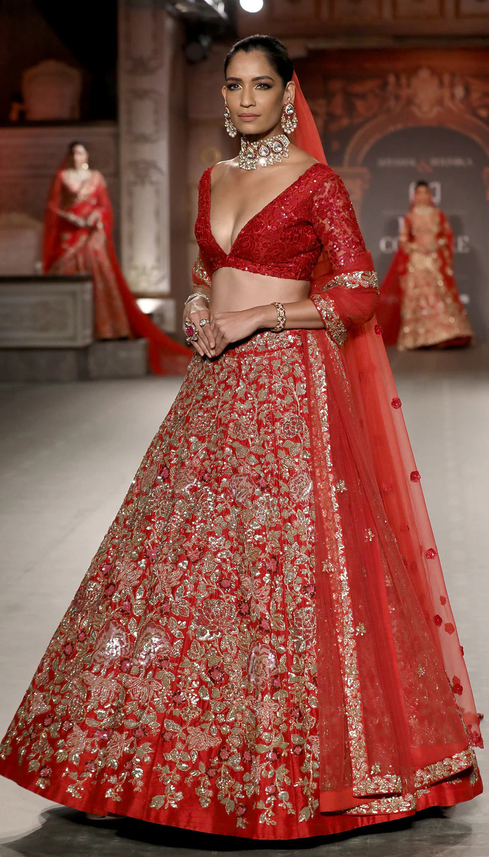 Model in The Deep Red Flower Cluster Lehenga by Shyamal & Bhumika.