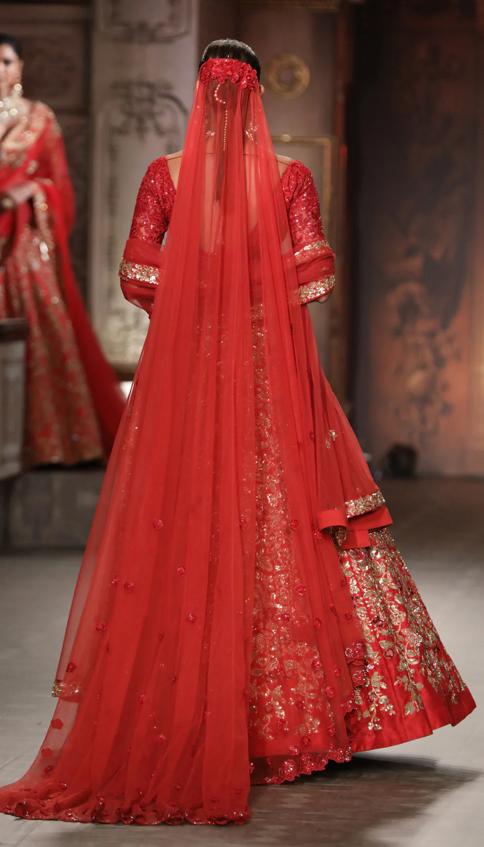 Model in The Deep Red Flower Cluster Lehenga by Shyamal & Bhumika.