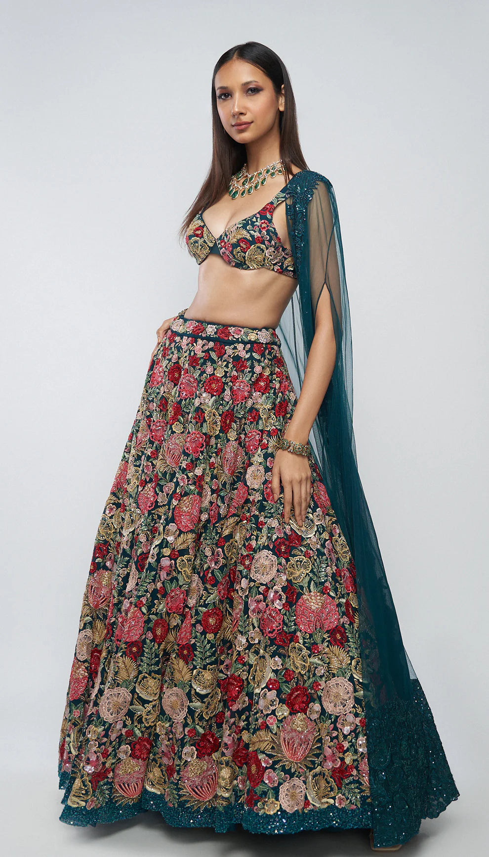Deep cyan, tulle net lehenga, tropical bloom embroidery, glass beads, sequins, crystals, lehenga, tulle net cape, bustier, wedding, receptions, sangeet nights, festive celebrations, blue lehenga, net lehenga, floral net lehenga