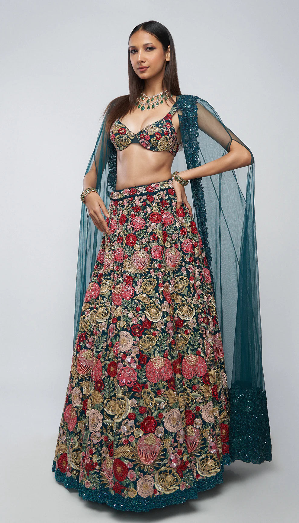 Deep cyan, tulle net lehenga, tropical bloom embroidery, glass beads, sequins, crystals, lehenga, tulle net cape, bustier, wedding, receptions, sangeet nights, festive celebrations, blue lehenga, net lehenga, floral net lehenga