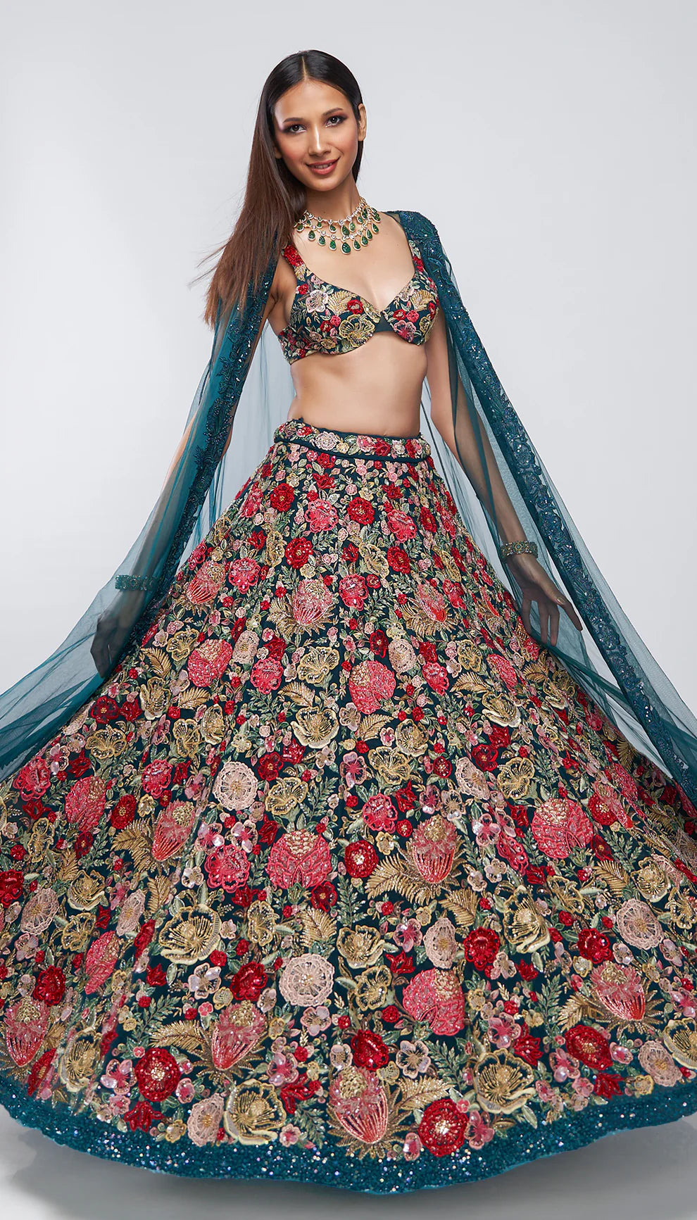 Deep cyan, tulle net lehenga, tropical bloom embroidery, glass beads, sequins, crystals, lehenga, tulle net cape, bustier, wedding, receptions, sangeet nights, festive celebrations, blue lehenga, net lehenga, floral net lehenga