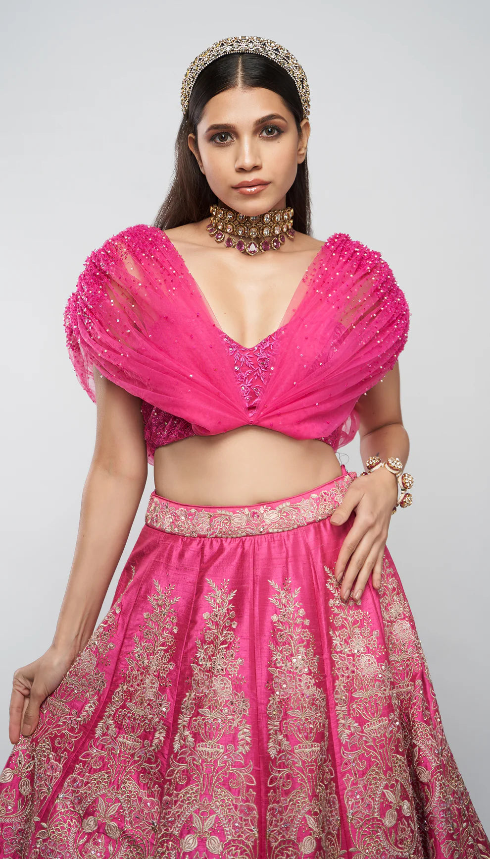 Candy pink, raw silk lehenga, floral bouquet embroidery, embellished tulle net blouse, wedding ceremonies, festive celebrations, evening occasions