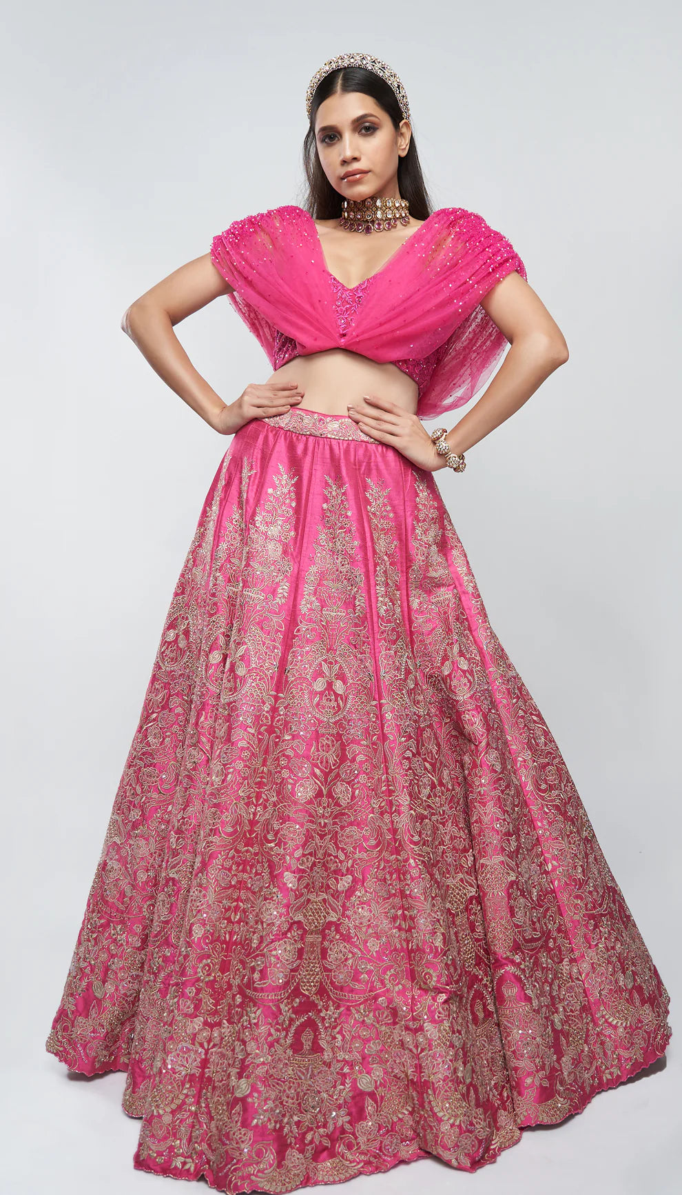 Candy pink, raw silk lehenga, floral bouquet embroidery, embellished tulle net blouse, wedding ceremonies, festive celebrations, evening occasions