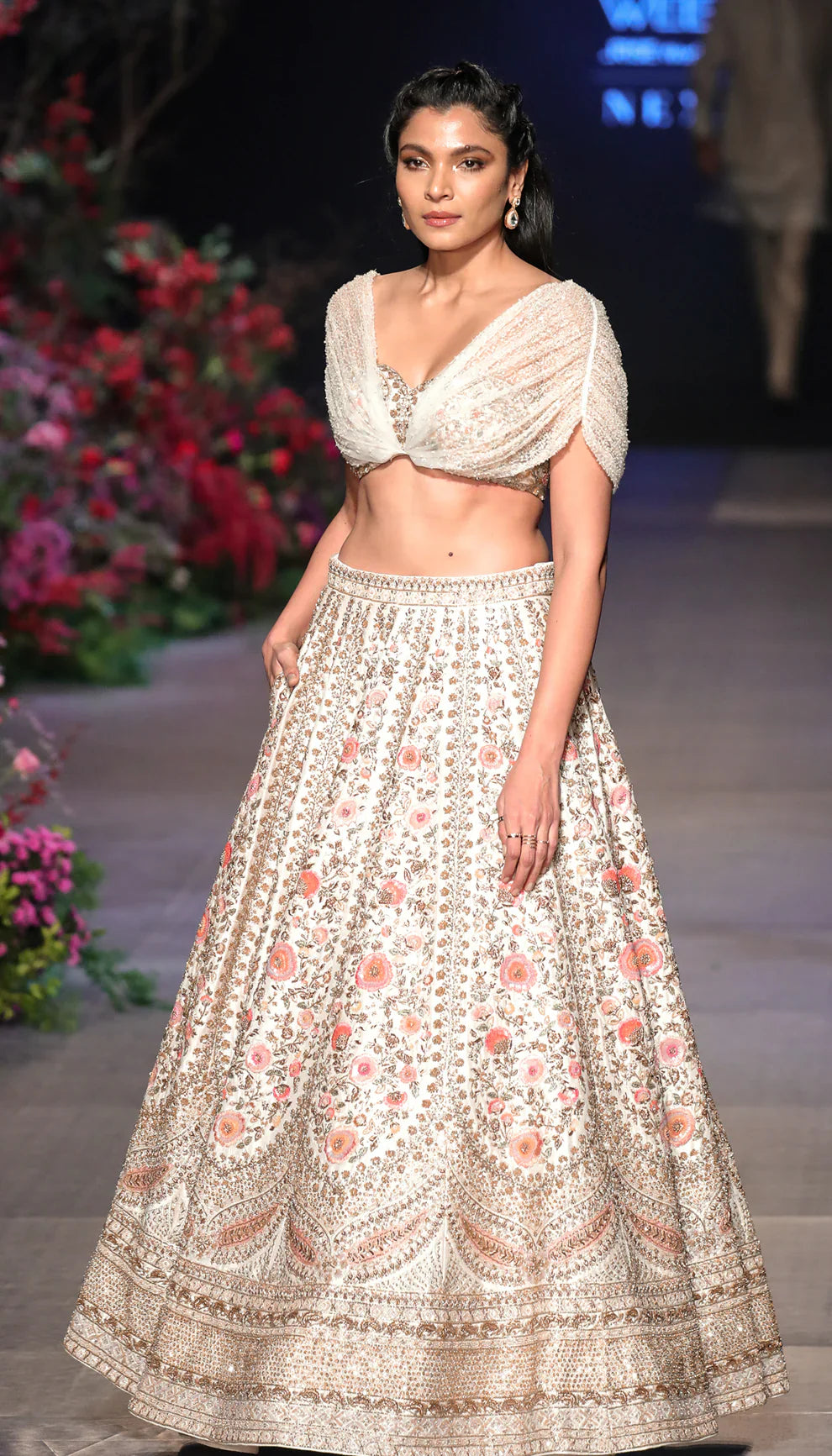 Woman in The Ivory Temple Embroidered Raw Silk Lehenga by Shyamal and Bhumika.