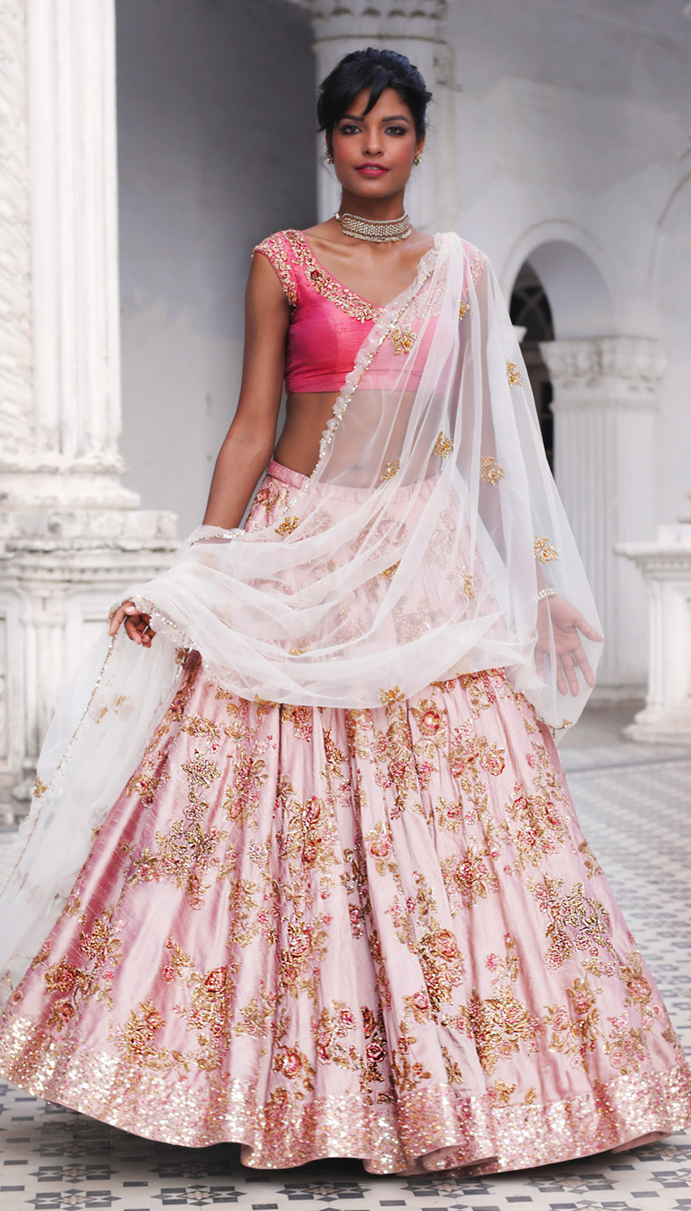 Woman in The Blush Pink Embroidered Lehenga by Shyamal & Bhumika.
