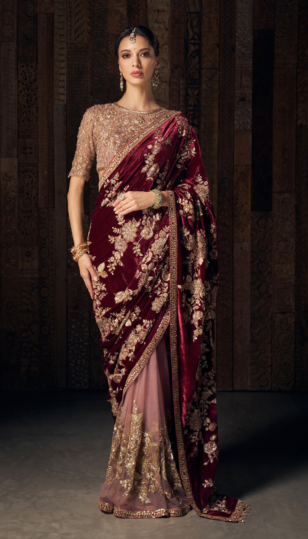 A resplendent wine velvet sari with opulent zardozi and peeta embroidery.