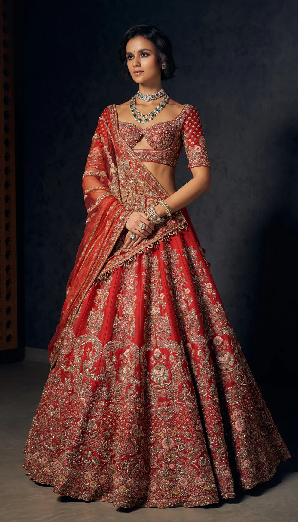 Raw silk, deep red bridal lehenga, Gujarati havelis, zardozi, peeta embroidery, tulle net dupatta, plunge- neck choli, tulle net drape, wedding pheras, reception evenings, festive celebrations, bridal lehenga, red lehenga, embroidered lehenga, zardozi lehenga, peeta lehenga