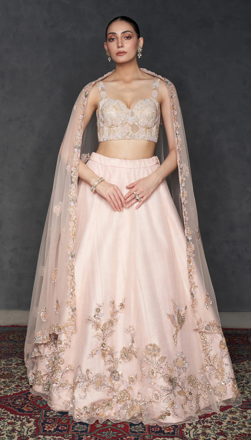 Woman in The Blush Pink Tulle Lehenga by Shyamal & Bhumika.