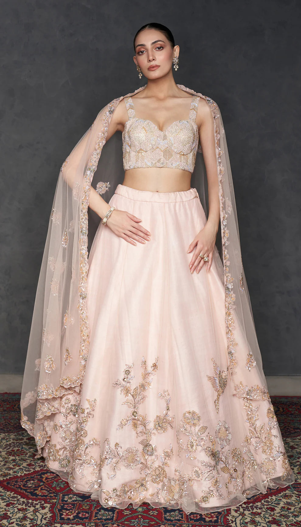 Woman in The Blush Pink Tulle Lehenga by Shyamal & Bhumika.