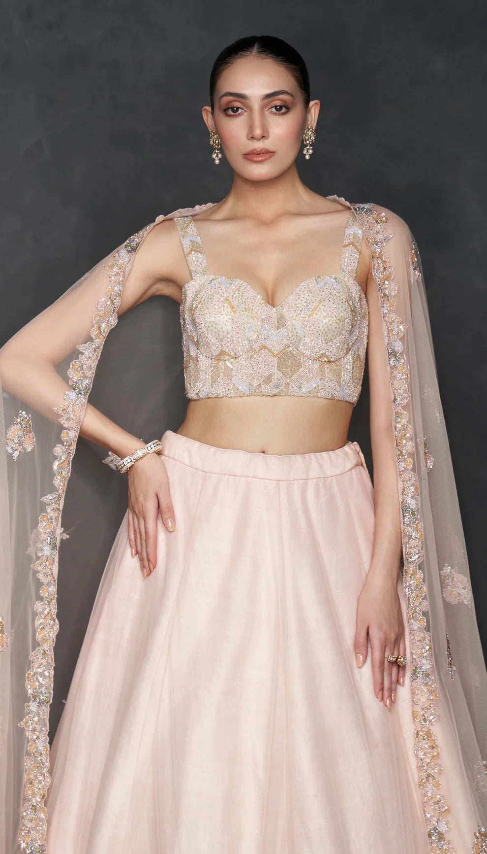 Woman in The Blush Pink Tulle Lehenga by Shyamal & Bhumika.