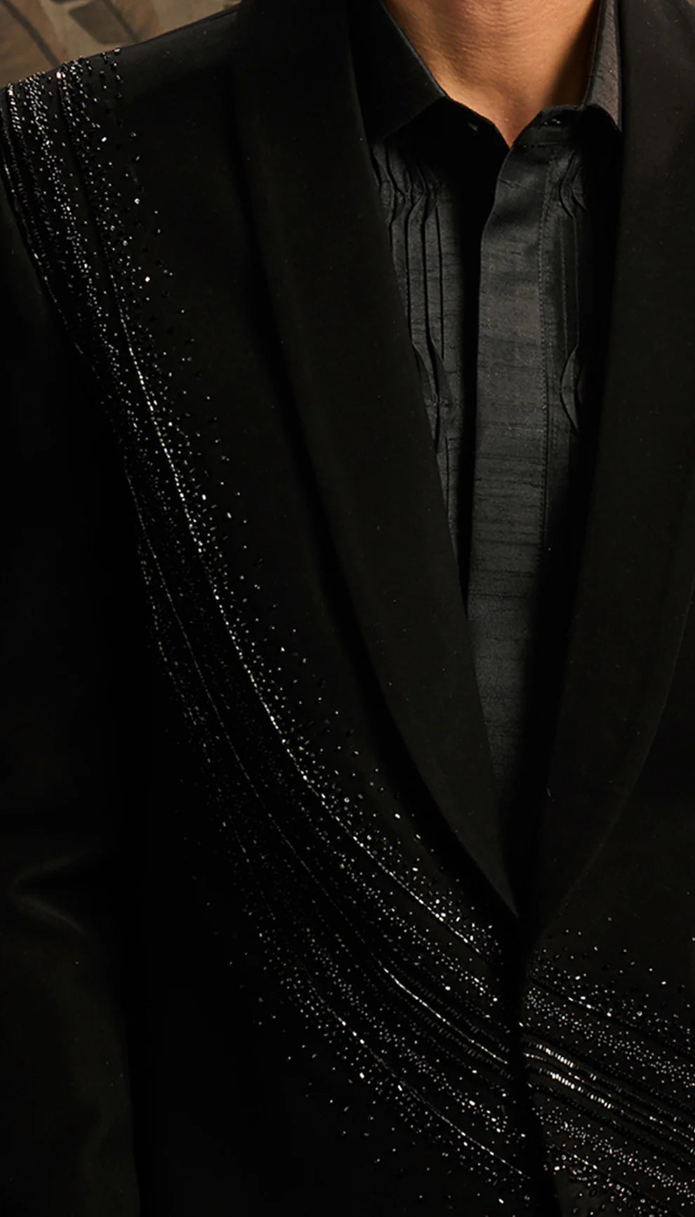Close-up of a black cocktail jacket by designers Shyamal and Bhumika