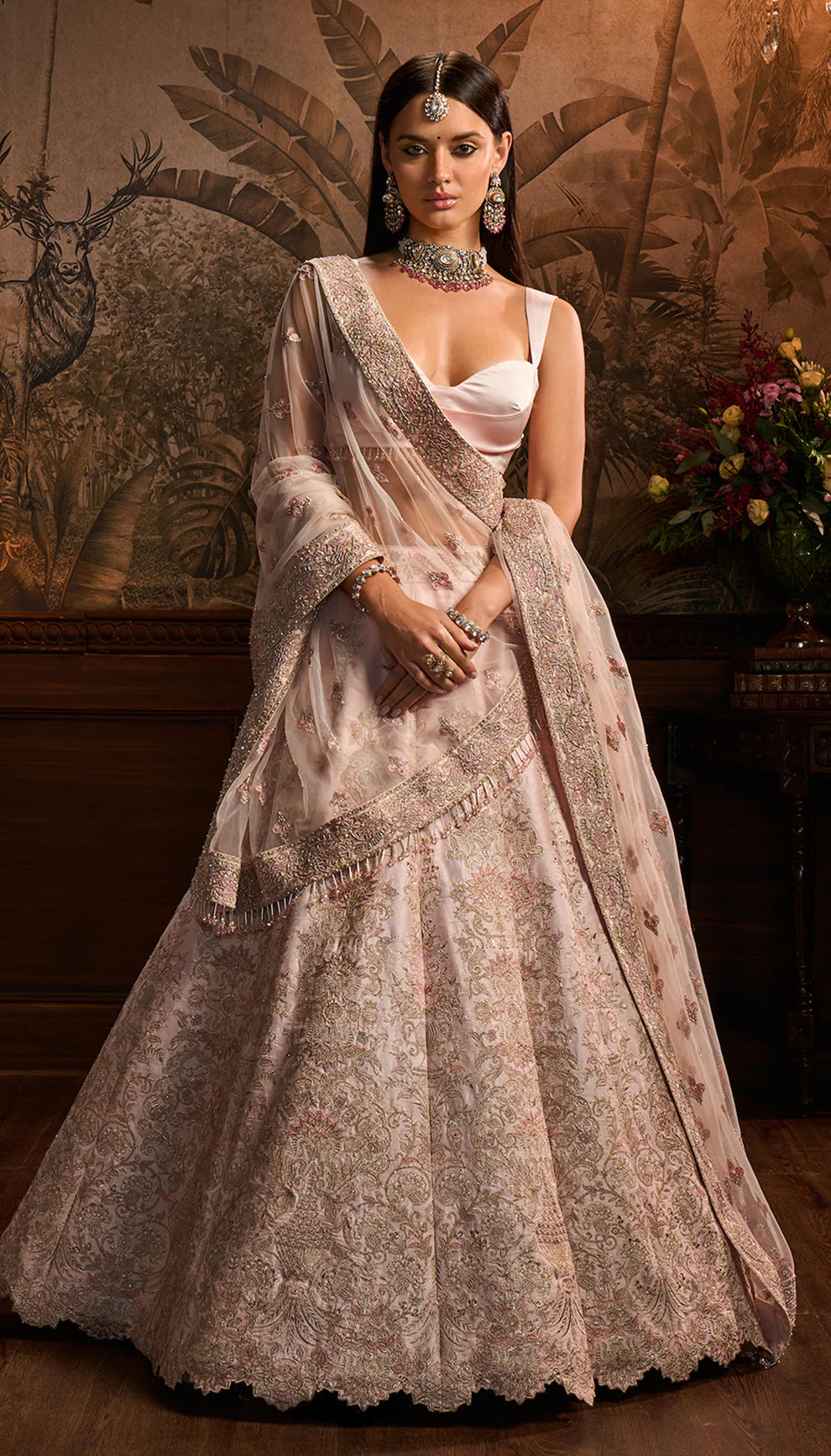 Powder pink raw silk lehenga, resham, rose gold embroidery, complementing satin silk bustier, tulle net dupatta, lehenga, daytime weddings, festive gatherings, evening celebrations
