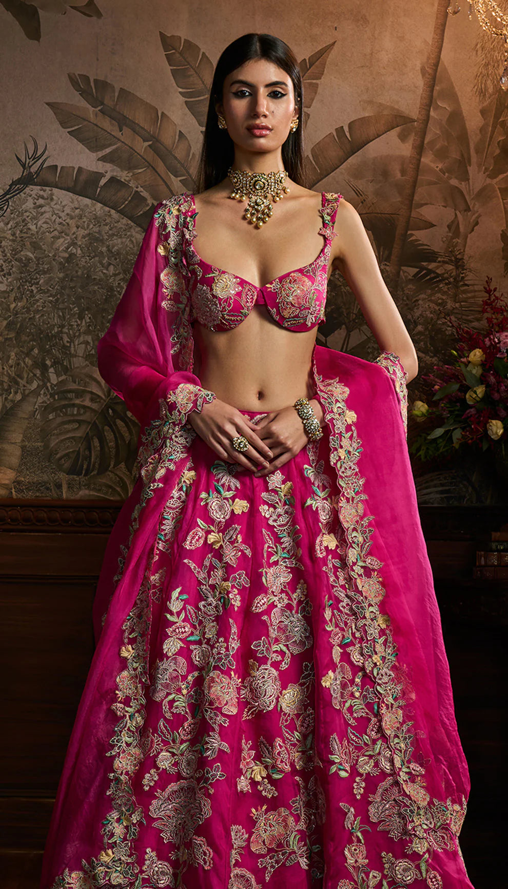 Rani pink silk organza lehenga, contrast resham embroidery, floral cutwork bustier, organza dupatta, lehenga, weddings, festive occasions, grand celebrations.