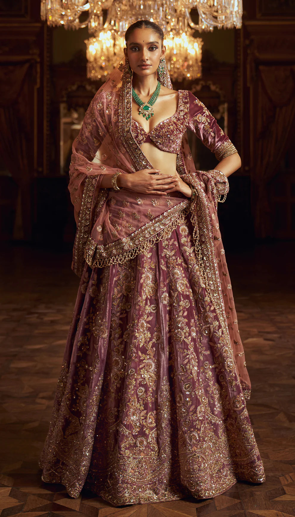 Sepia purple, silk velvet lehenga, gold zardozi embroidery, jaali patterns, Rajasthani miniatures, cut away hem choli, sheer tulle net dupatta, pink bridal lehenga, weddings, festive celebrations, evening occasions, purple lehenga, silk velvet lehenga, designer purple lehenga, designer silk velvet lehenga, destination wedding, sangeet, reception