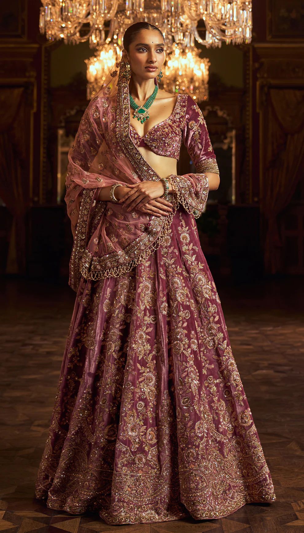 Sepia purple, silk velvet lehenga, gold zardozi embroidery, jaali patterns, Rajasthani miniatures, cut away hem choli, sheer tulle net dupatta, pink bridal lehenga, weddings, festive celebrations, evening occasions, purple lehenga, silk velvet lehenga, designer purple lehenga, designer silk velvet lehenga, destination wedding, sangeet, reception