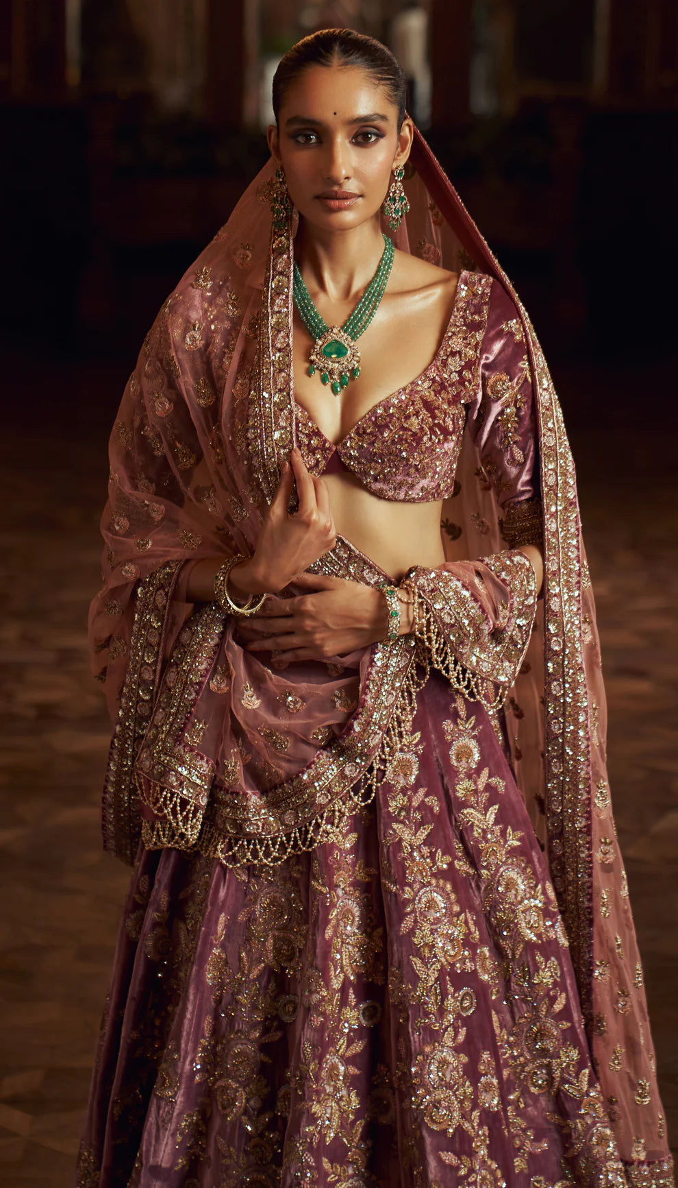 Sepia purple, silk velvet lehenga, gold zardozi embroidery, jaali patterns, Rajasthani miniatures, cut away hem choli, sheer tulle net dupatta, pink bridal lehenga, weddings, festive celebrations, evening occasions, purple lehenga, silk velvet lehenga, designer purple lehenga, designer silk velvet lehenga, destination wedding, sangeet, reception