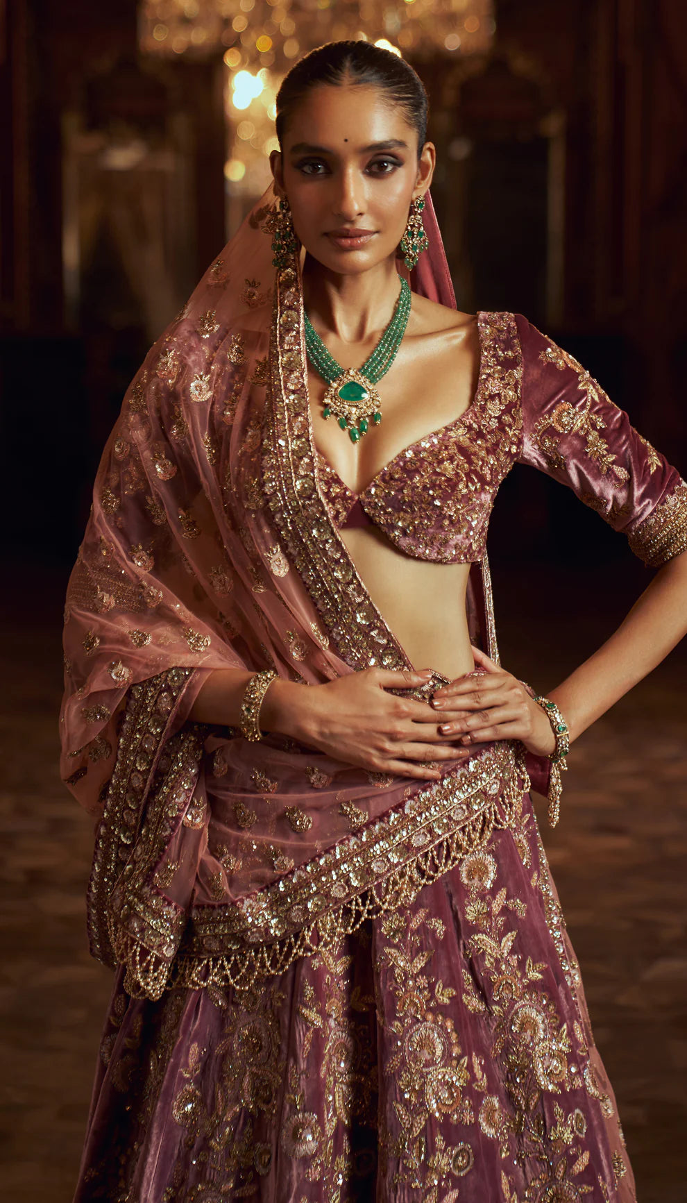 Sepia purple, silk velvet lehenga, gold zardozi embroidery, jaali patterns, Rajasthani miniatures, cut away hem choli, sheer tulle net dupatta, pink bridal lehenga, weddings, festive celebrations, evening occasions, purple lehenga, silk velvet lehenga, designer purple lehenga, designer silk velvet lehenga, destination wedding, sangeet, reception
