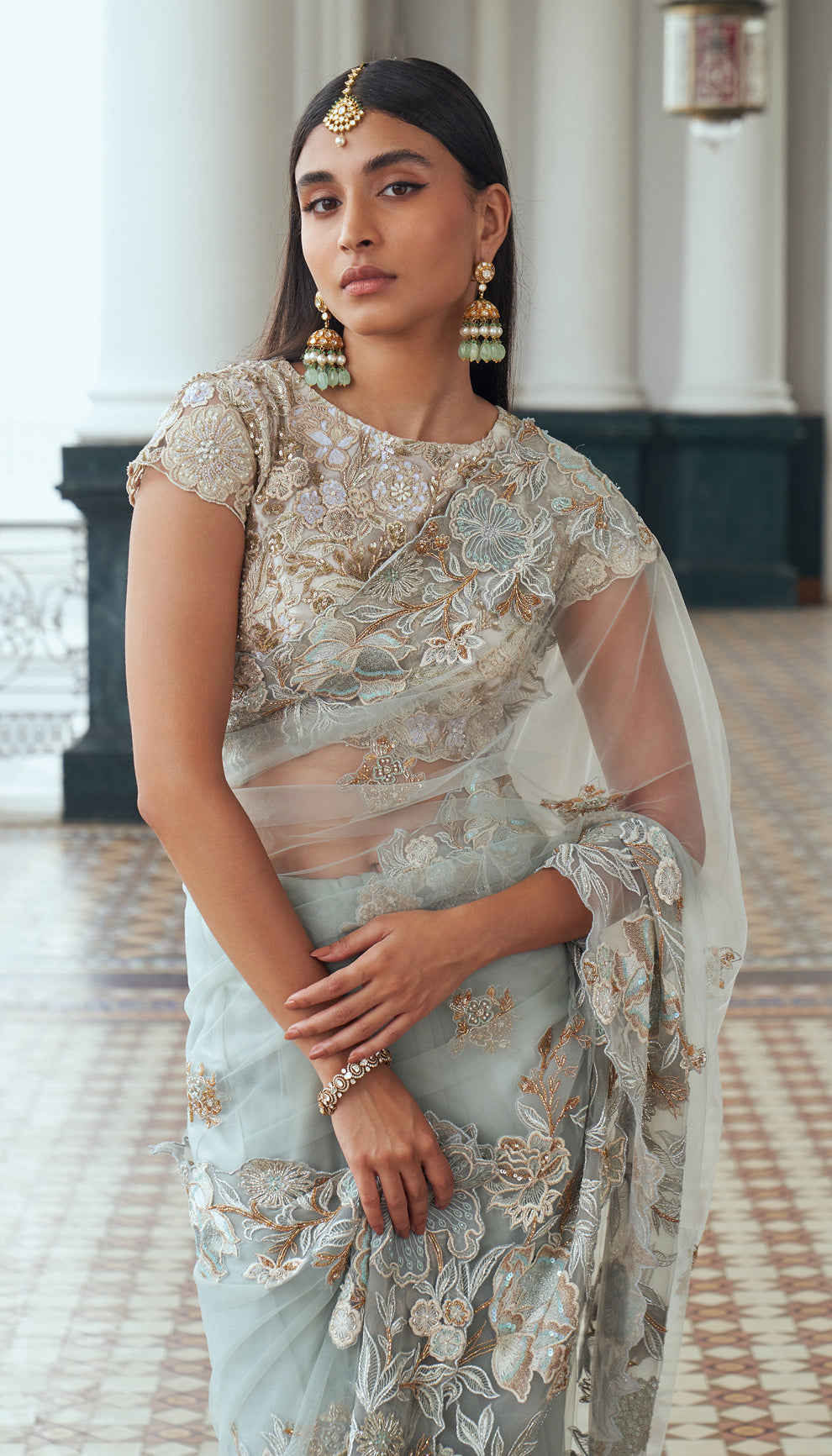 Frost blue, tulle net saree, floral motifs, embroidered, resham, sequins, embellished, warm ivory, tulle net blouse, light blue saree, weddings, festive occasions, evening parties, blue saree, designer blue saree, designer net saree, designer blue net saree, destination wedding, sangeet, haldi, mehndi, reception, festive wear, occasion wear