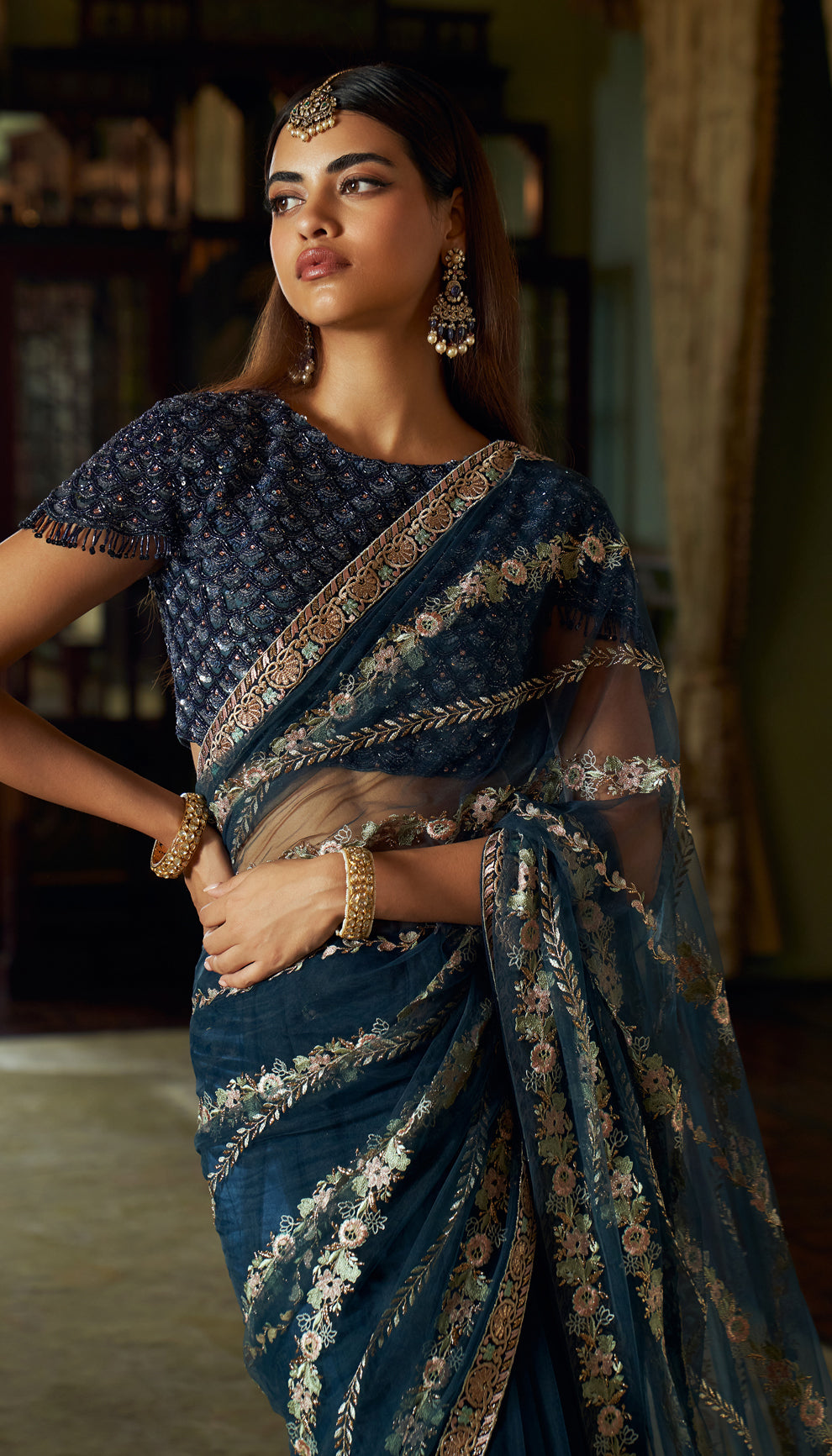 Midnight blue, tulle net saree, lotus motifs, resham, baadla taar, sequined, tulle net blouse, blue saree, evening weddings, festive gatherings, sophisticated celebrations, destination wedding, trousseau, sangeet, haldi, mehndi, reception, dark blue saree, net saree, designer blue saree, designer net saree, festive wear, occasion wear