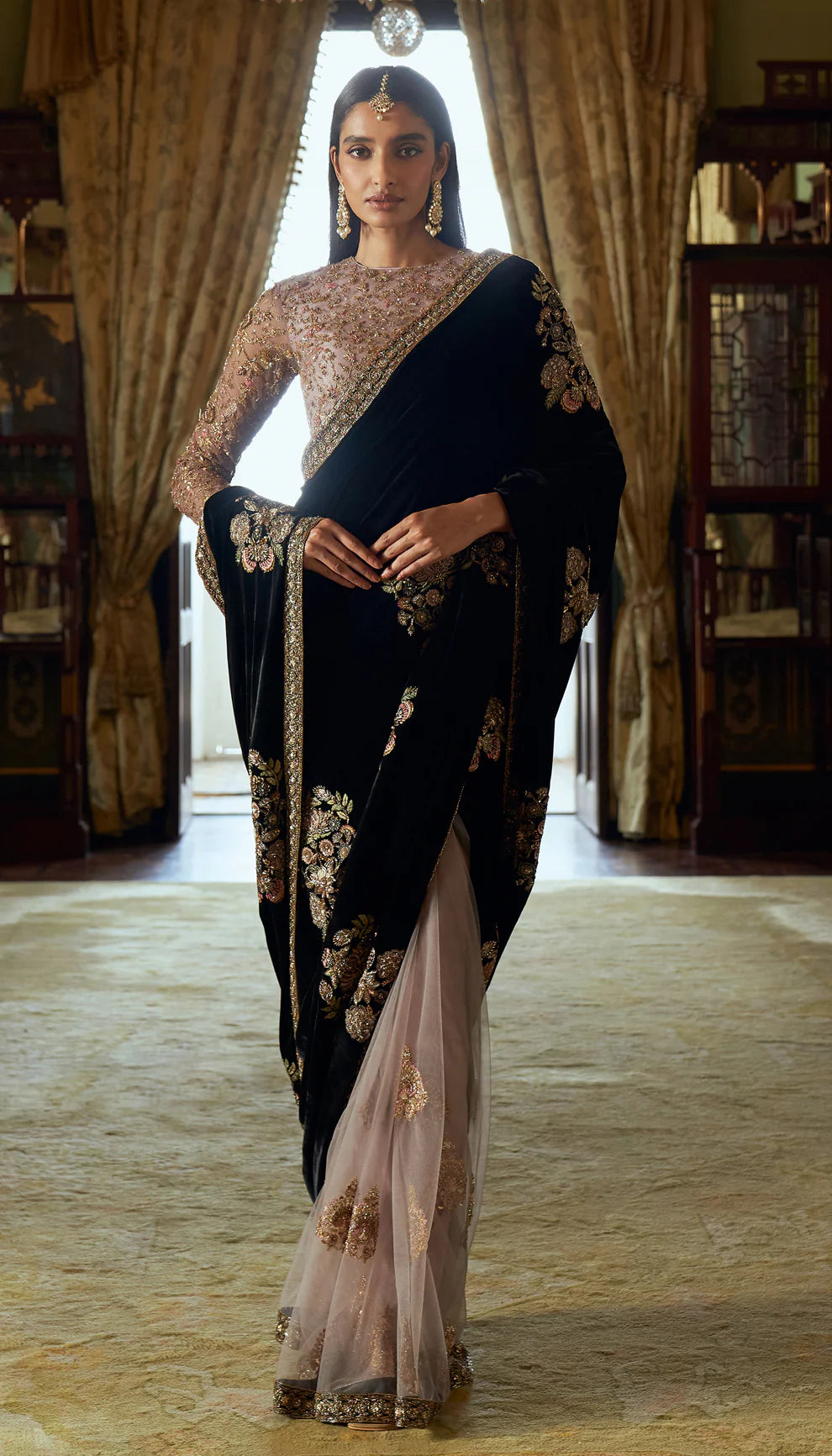 Cobalt black, velvet saree, floral motifs, embroidered, resham, zardozi work, Mughal inlays, embellished, tulle net choli, black velvet saree, bridal functions, festive celebrations, evening events, black saree, designer black saree, designer velvet saree, trousseau