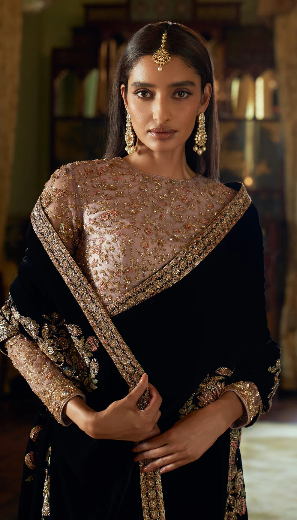 Cobalt black, velvet saree, floral motifs, embroidered, resham, zardozi work, Mughal inlays, embellished, tulle net choli, black velvet saree, bridal functions, festive celebrations, evening events, black saree, designer black saree, designer velvet saree, trousseau