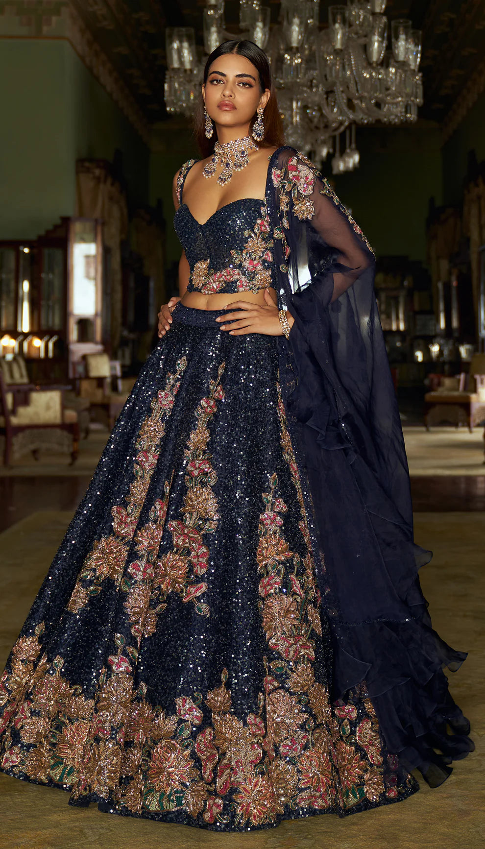 Midnight blue, raw silk lehenga, floral, embroidered, sequin base, glass beads, sequins, gold zardozi, tulle net, corset blouse, sheer organza dupatta, blue lehenga, weddings, festive celebrations, evening receptions