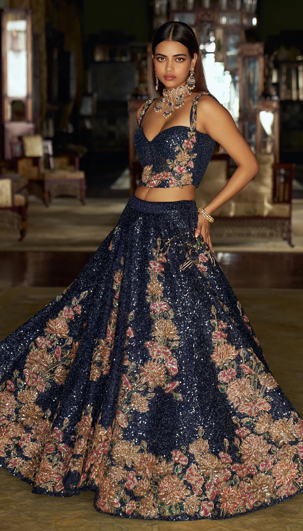 Midnight blue, raw silk lehenga, floral, embroidered, sequin base, glass beads, sequins, gold zardozi, tulle net, corset blouse, sheer organza dupatta, blue lehenga, weddings, festive celebrations, evening receptions