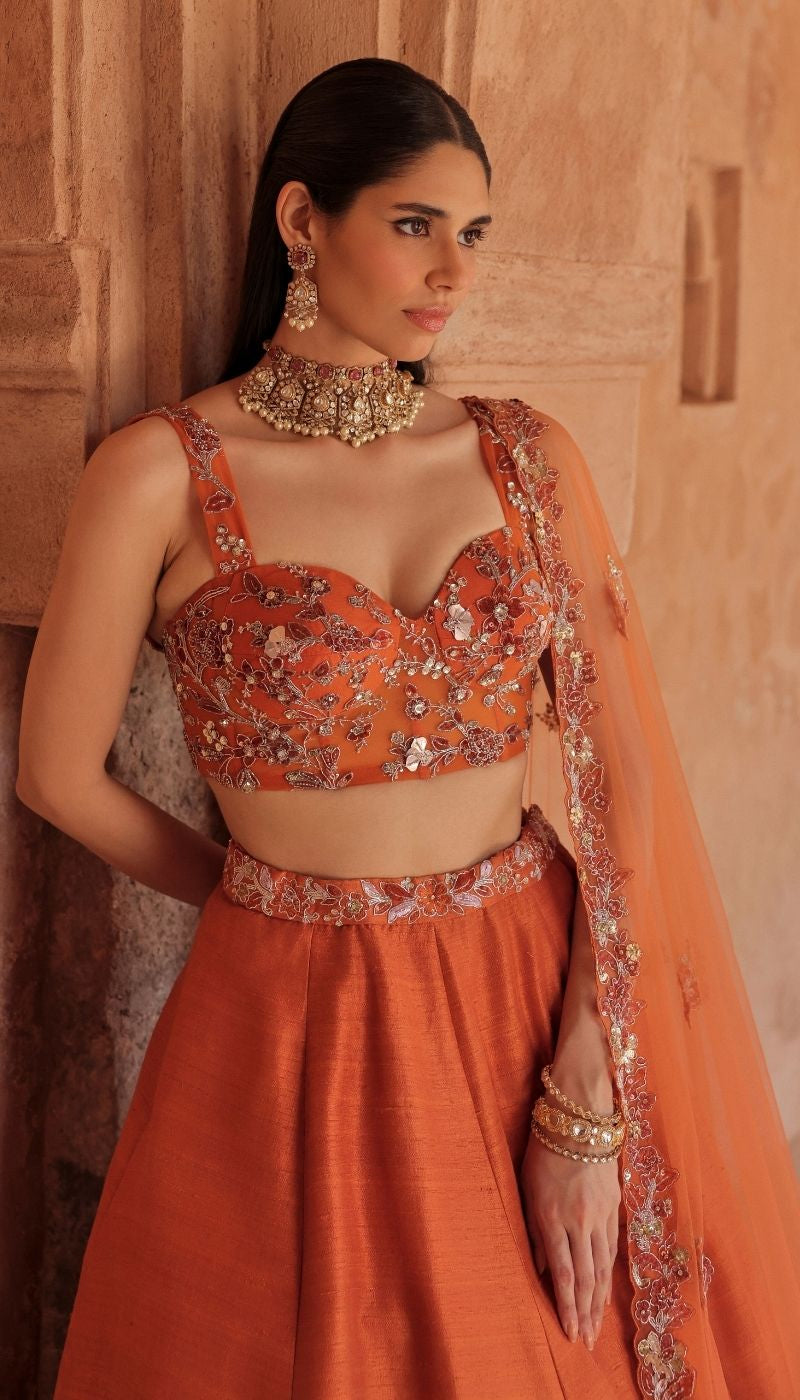 A Warm Burnt Orange Raw silk Panelled Lehenga Set