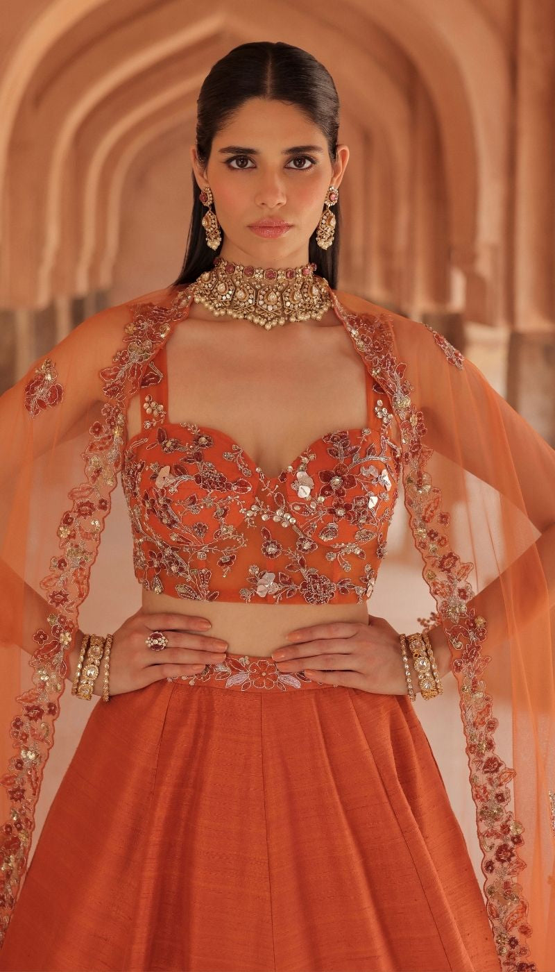 A Warm Burnt Orange Raw silk Panelled Lehenga Set