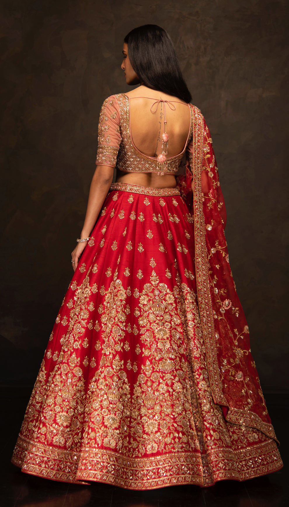 The Red Embroidered Raw Silk Bridal Lehenga