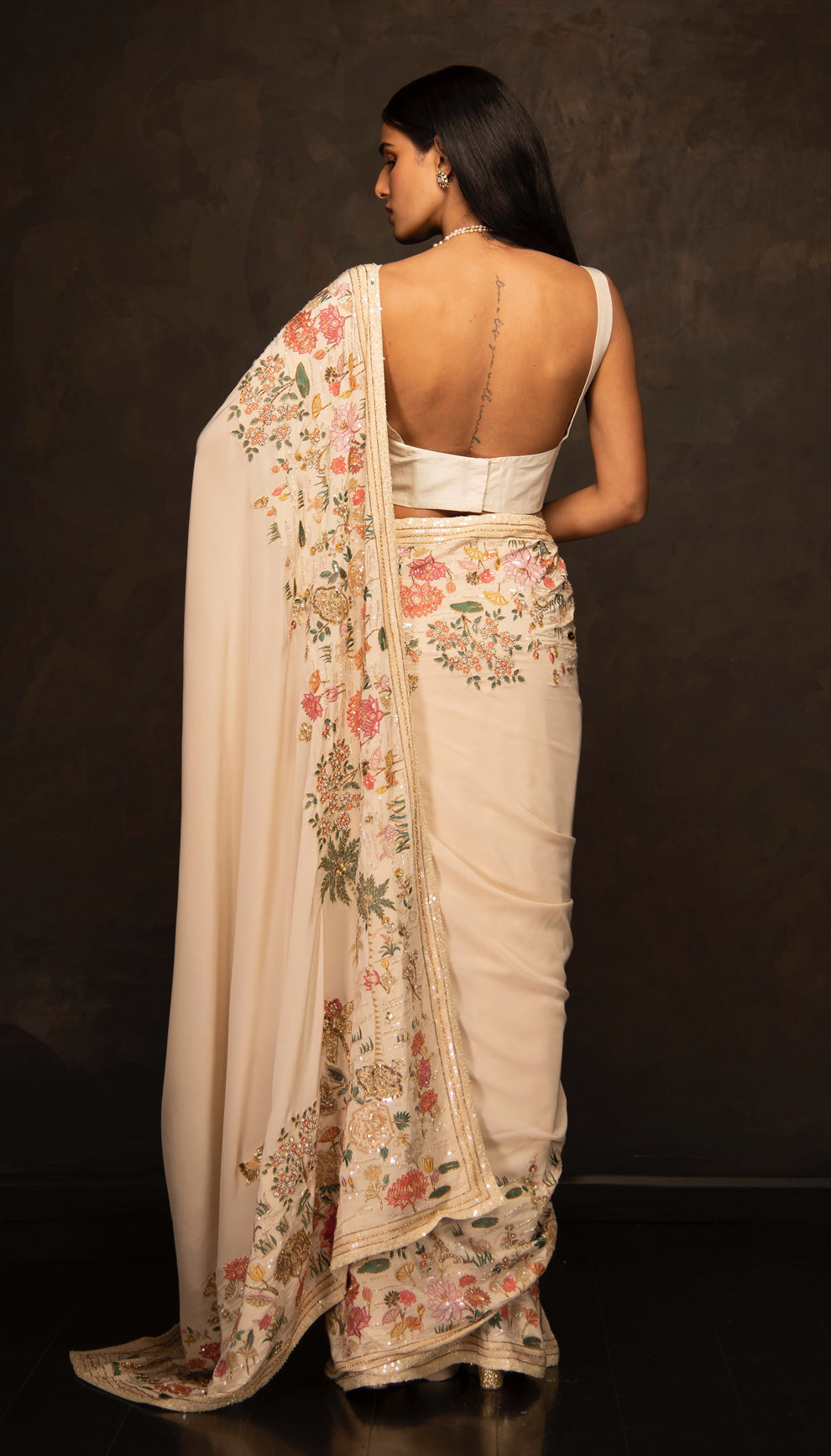 The Ivory Embroidered Crepe Silk Saree