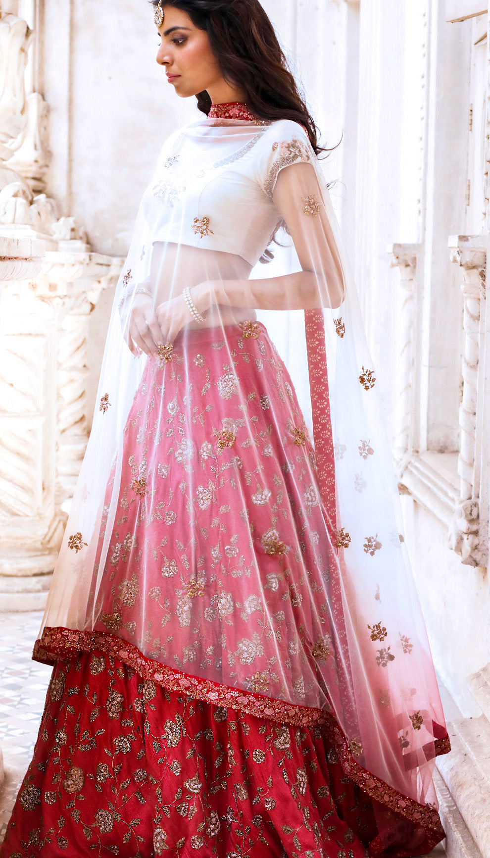 Woman in The Rani Pink Embroidered Lehenga by Shyamal & Bhumika.