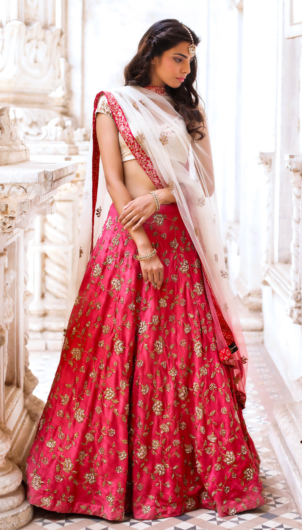 Woman in The Rani Pink Embroidered Lehenga by Shyamal & Bhumika.