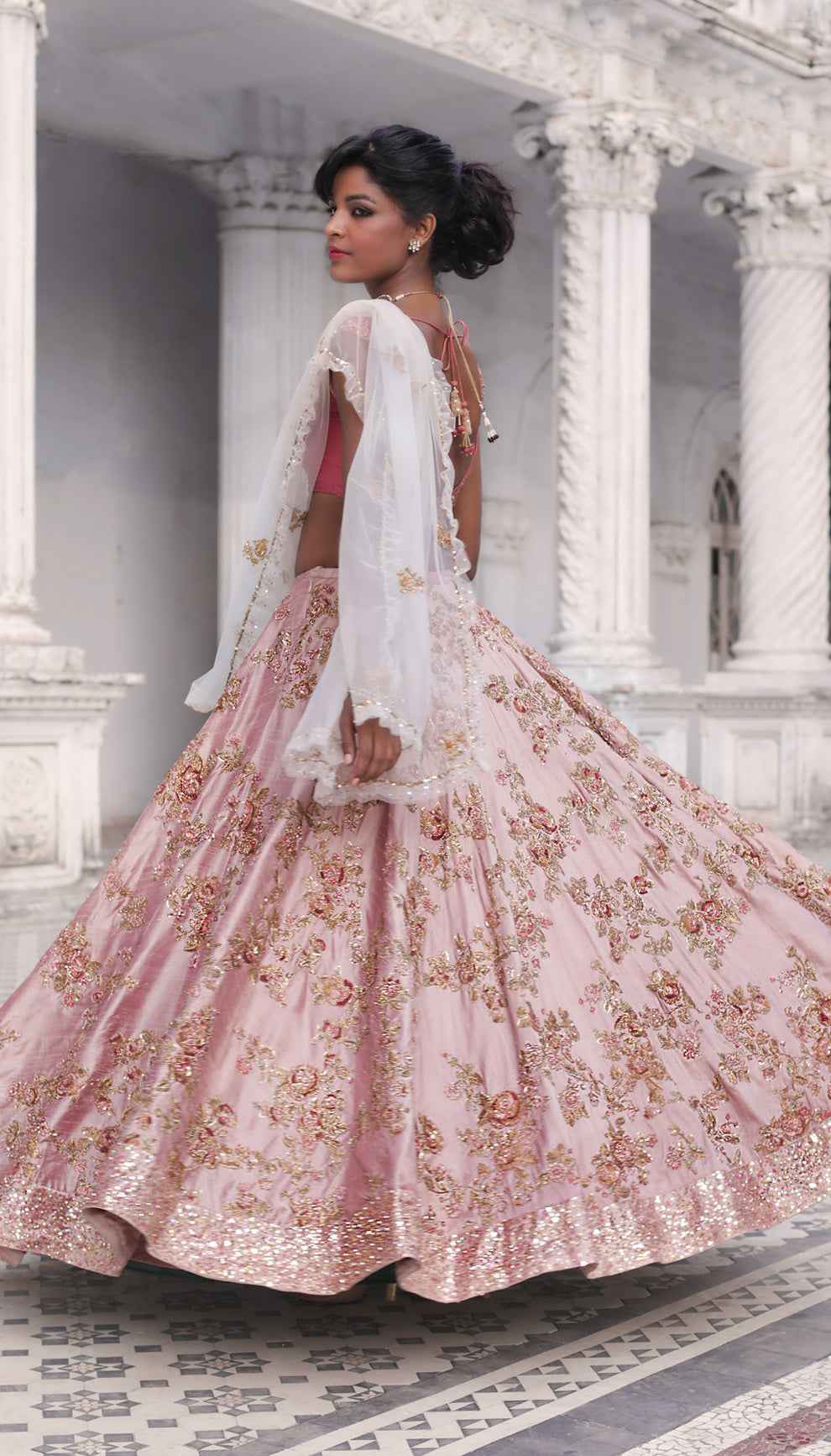 Woman in The Blush Pink Embroidered Lehenga by Shyamal & Bhumika.