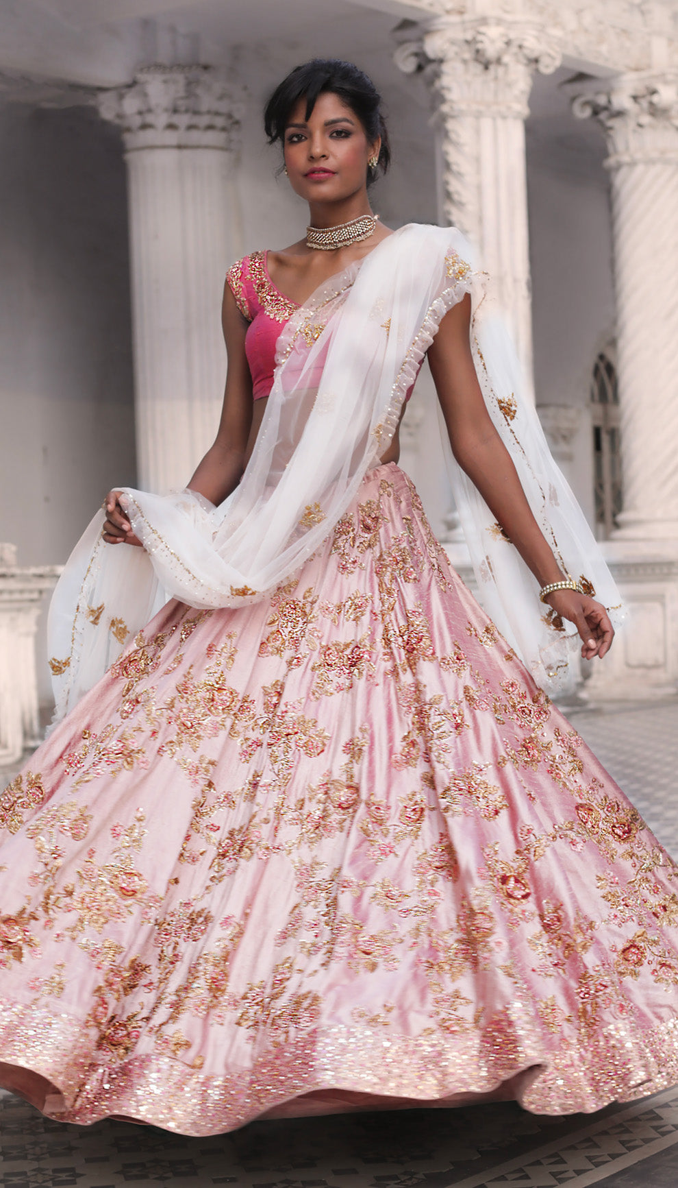 Woman in The Blush Pink Embroidered Lehenga by Shyamal & Bhumika.
