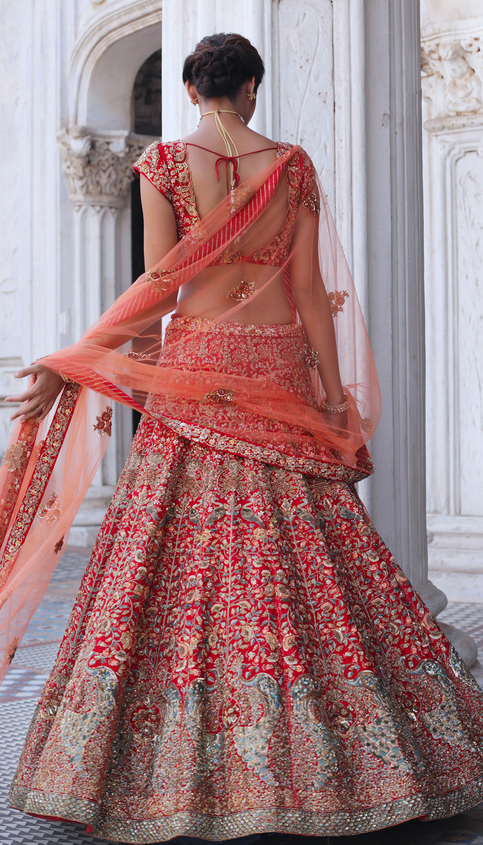 Woman wearing The Flaming Scarlet Peacock Lehenga by Shyamal & Bhumika.
