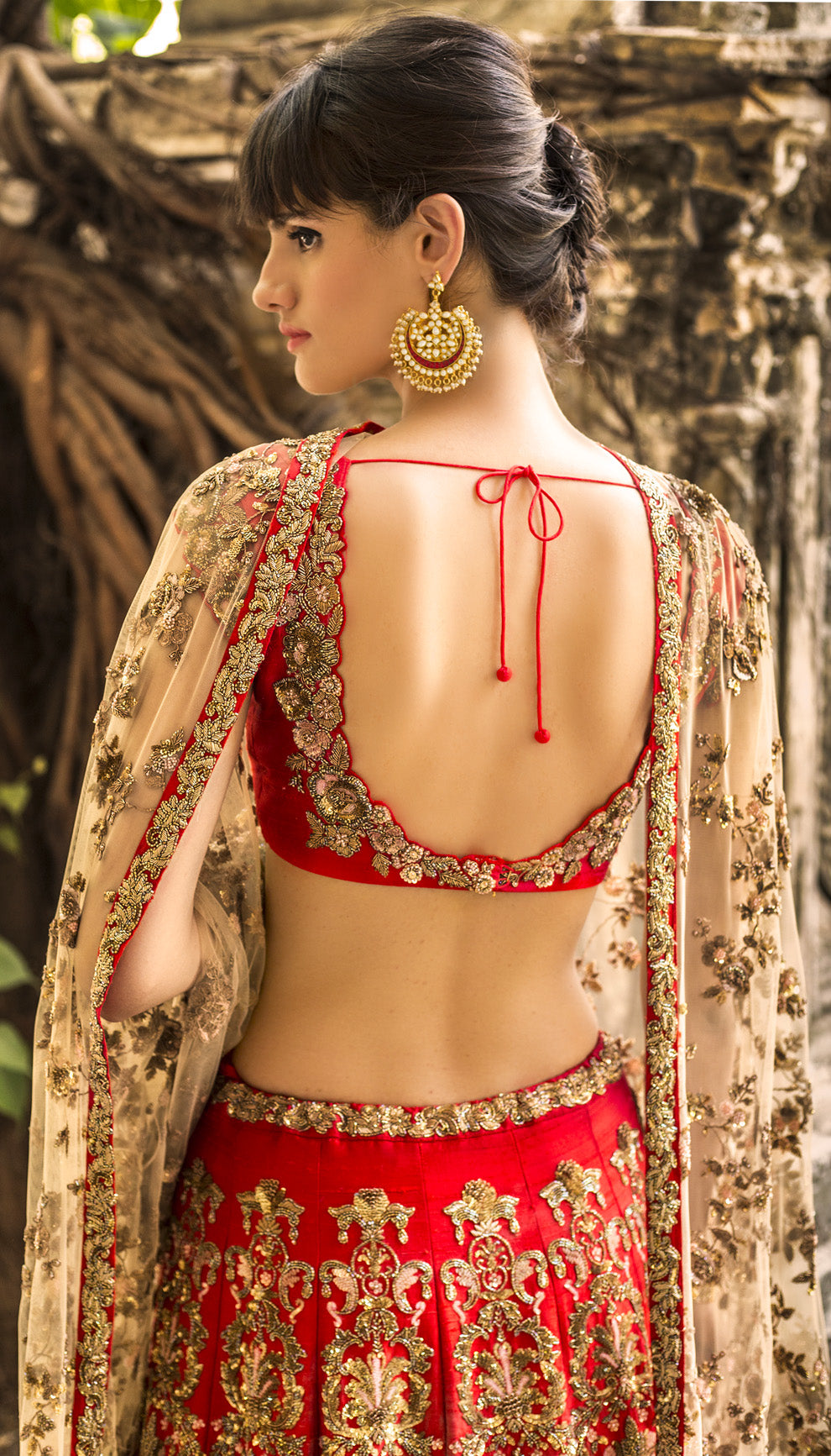 Woman in The Flaming Scarlet Raw Silk Lehenga by Shyamal & Bhumika.