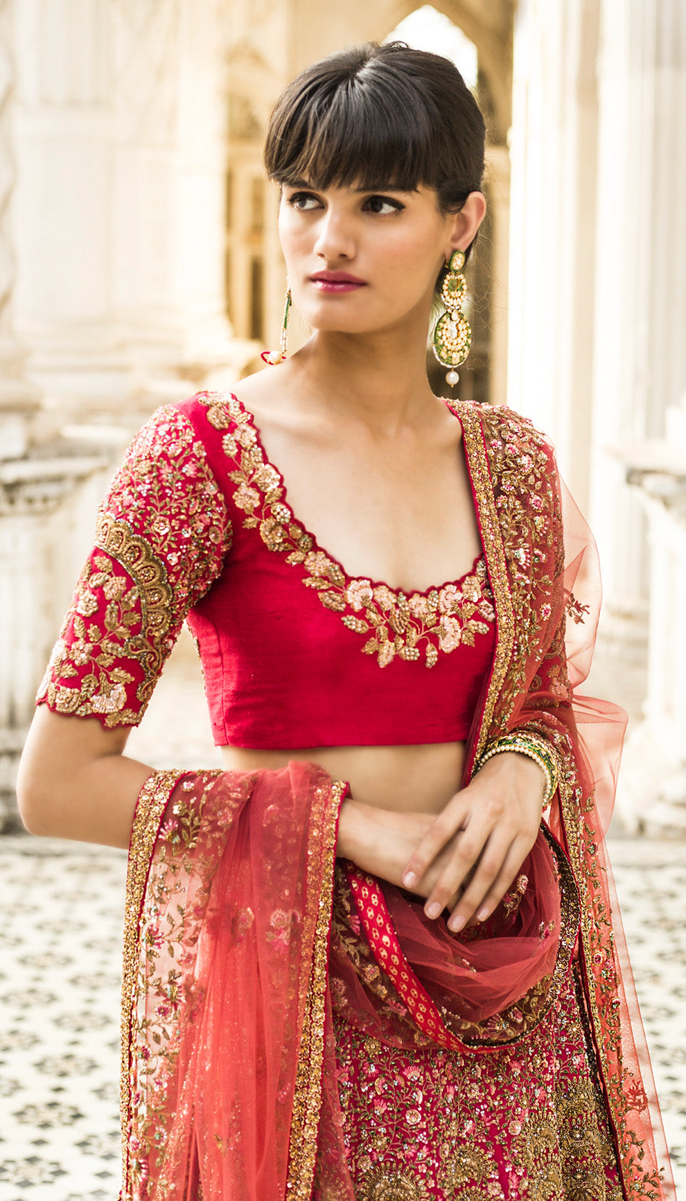 Woman in The Spiced Coral Raw Silk Lehenga by Shyamal & Bhumika.
