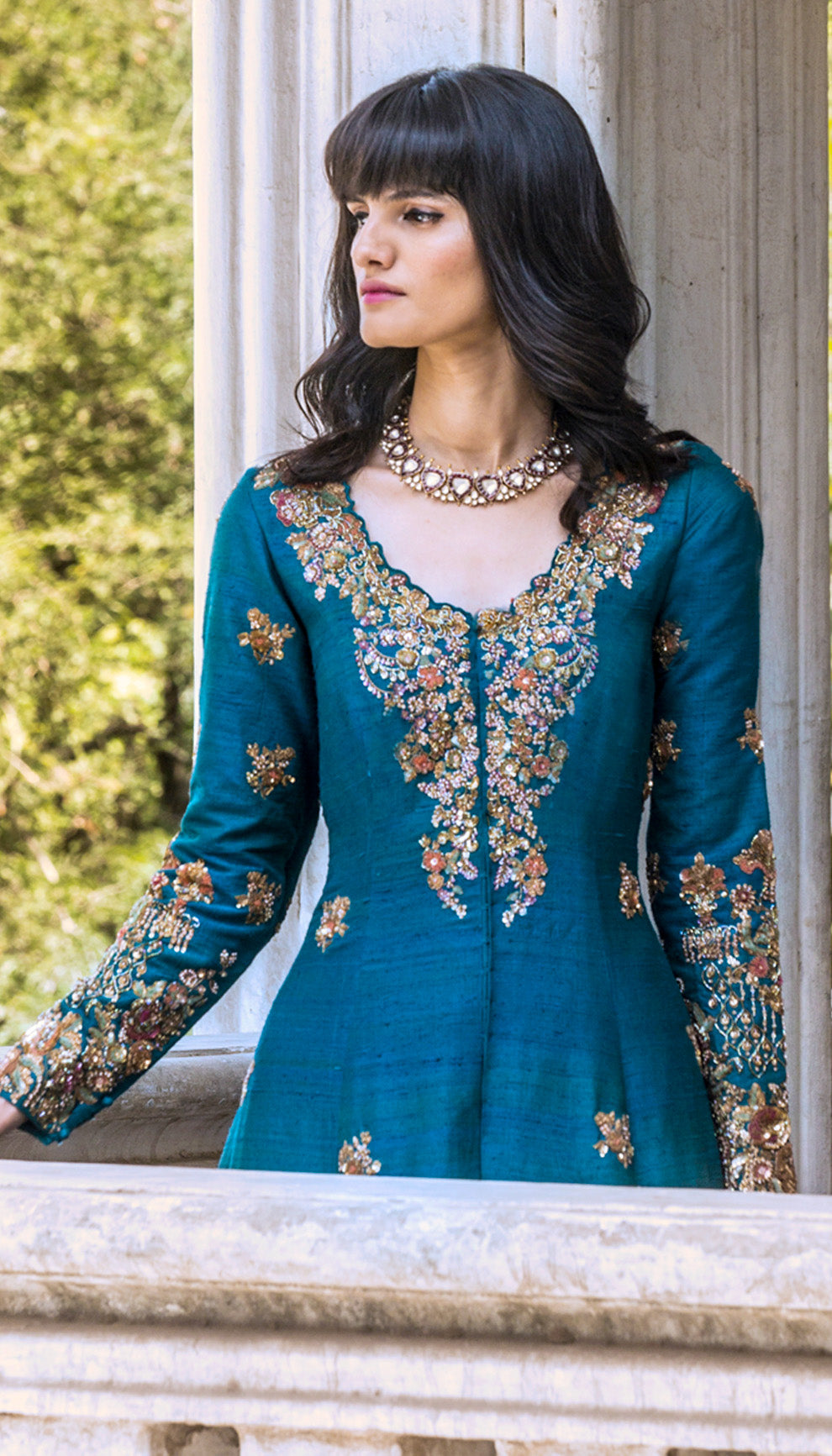 Woman wearing The Blue Bejeweled Jacket Lehenga by Shyamal & Bhumika.