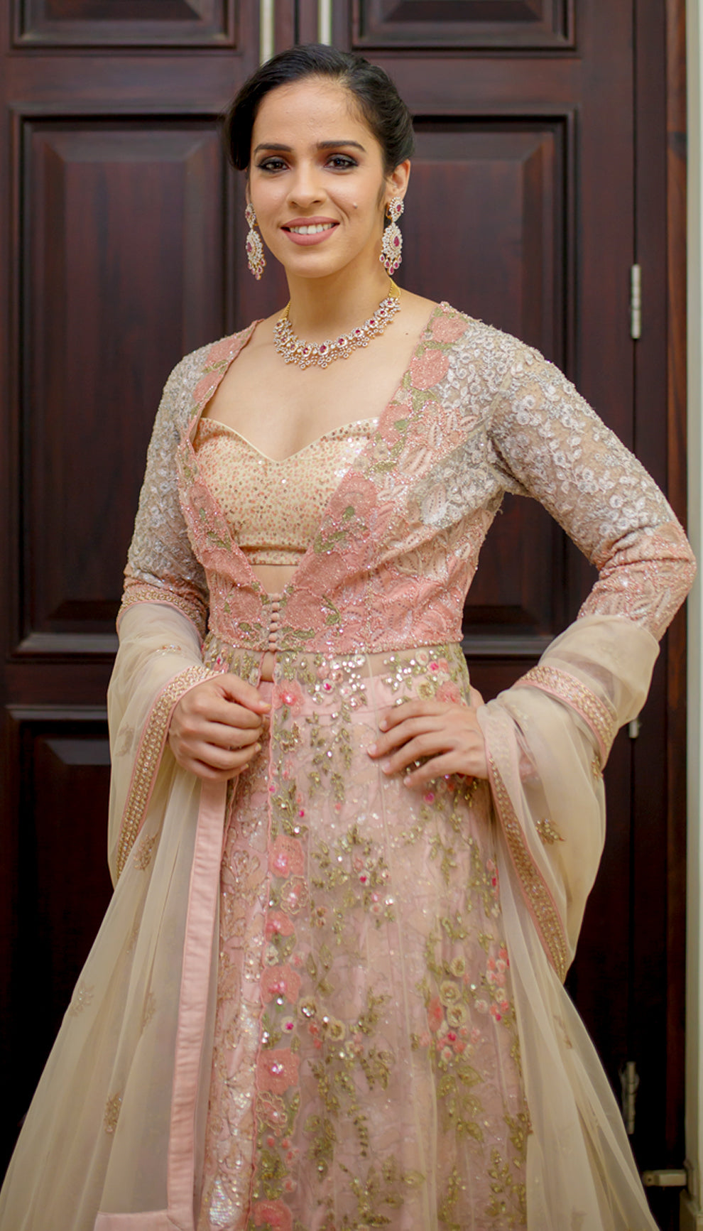 Saina Nehwal in a pink floral jacket lehenga by shyamal & bhumika