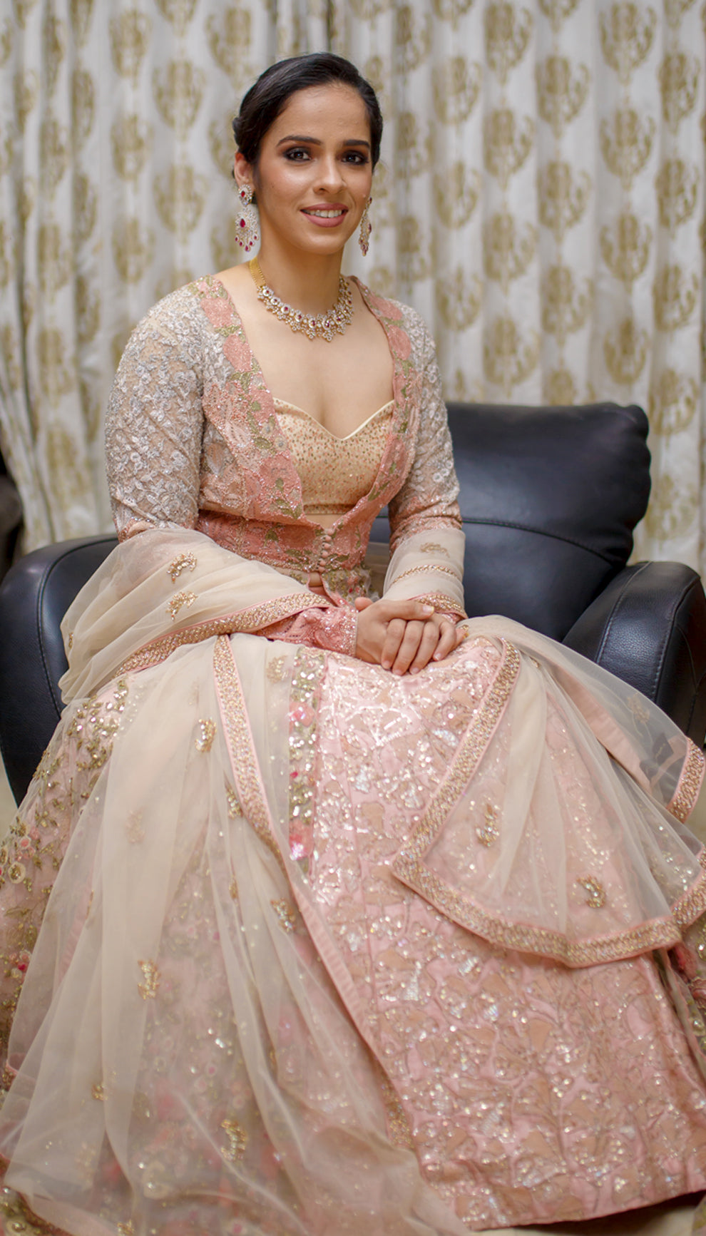Saina Nehwal in a pink floral jacket lehenga by shyamal & bhumika