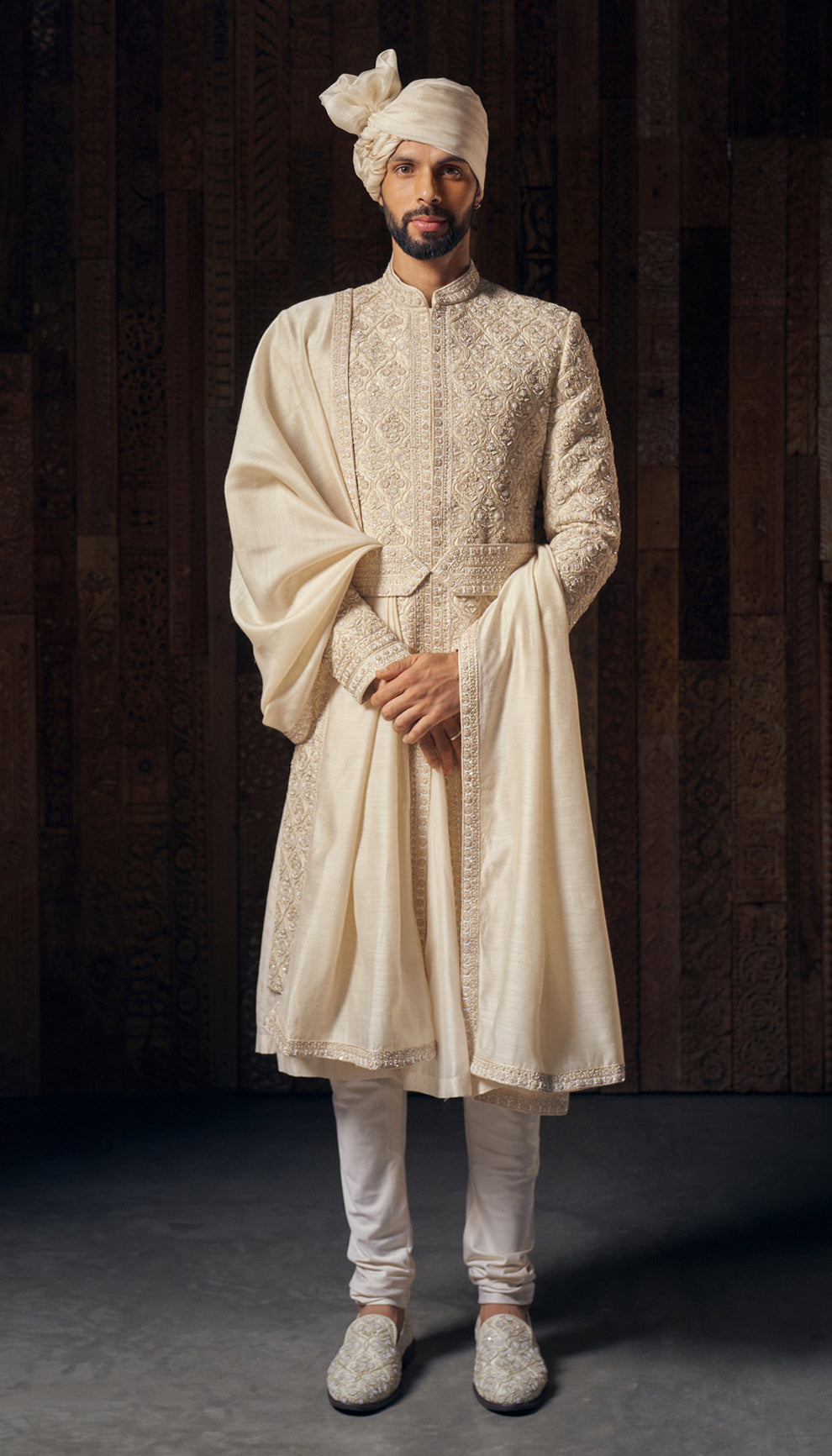 A muted ivory raw silk sherwani