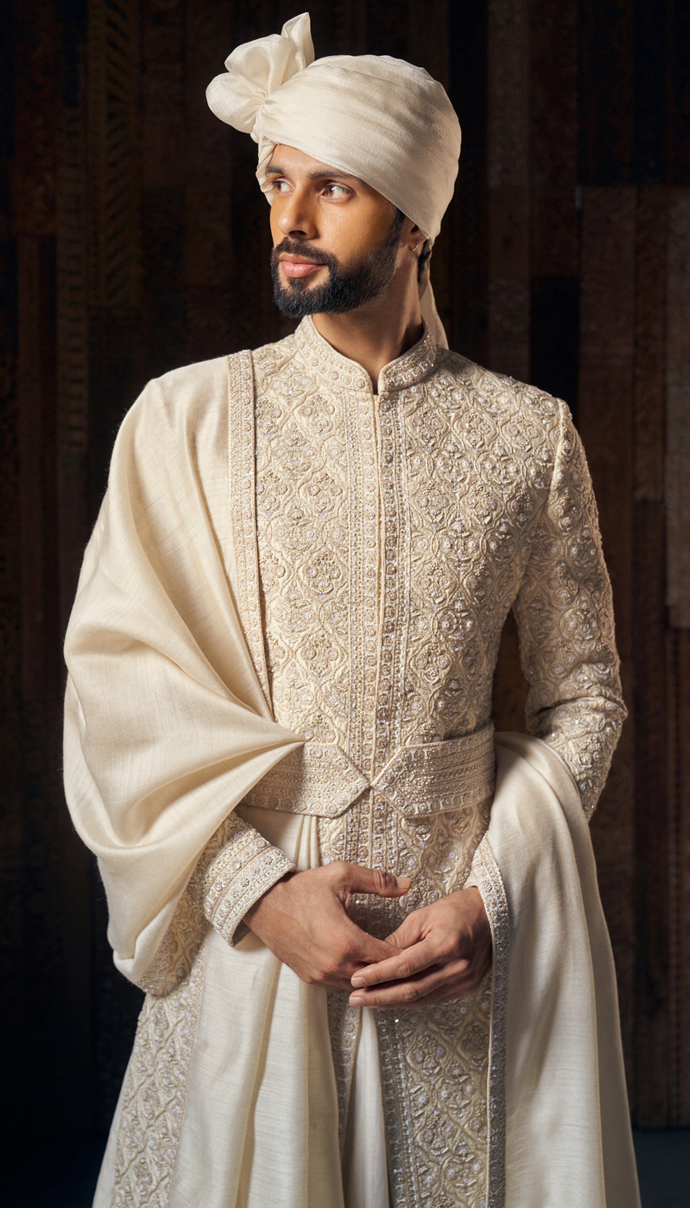 A muted ivory raw silk sherwani