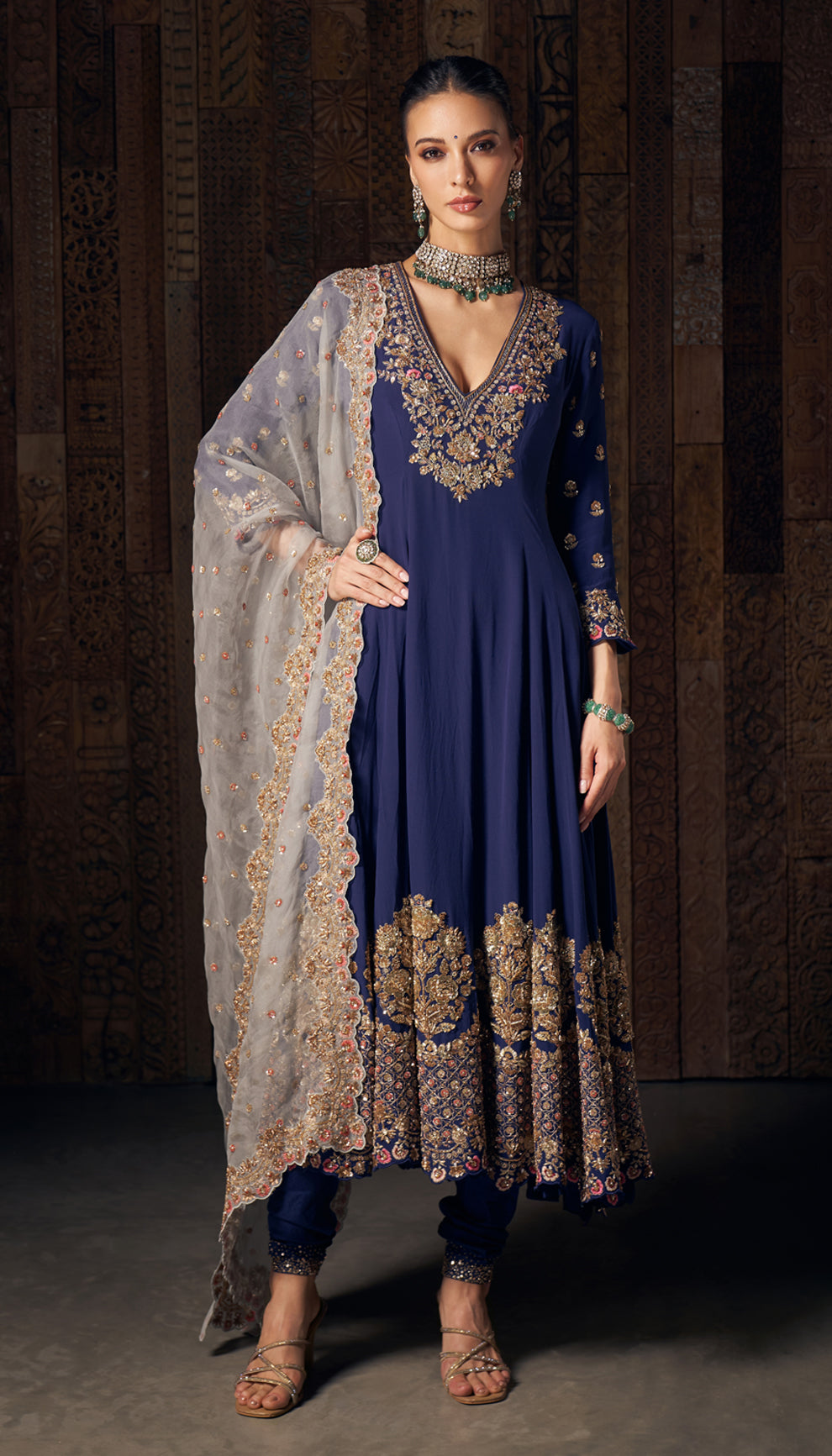 A midnight blue crepe silk kalidar kurta with intricate vintage gold zardozi embroidery