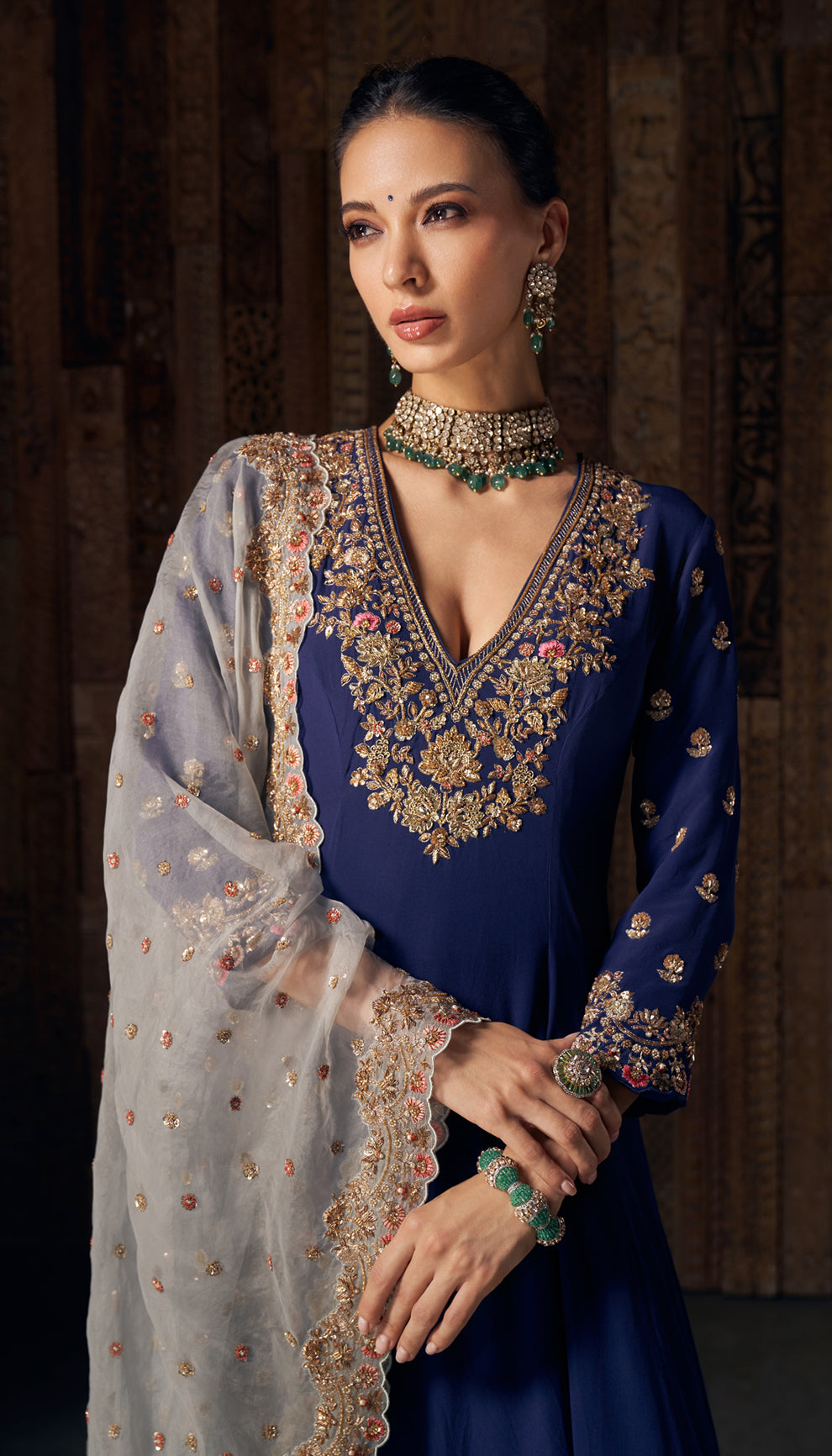 A midnight blue crepe silk kalidar kurta with intricate vintage gold zardozi embroidery