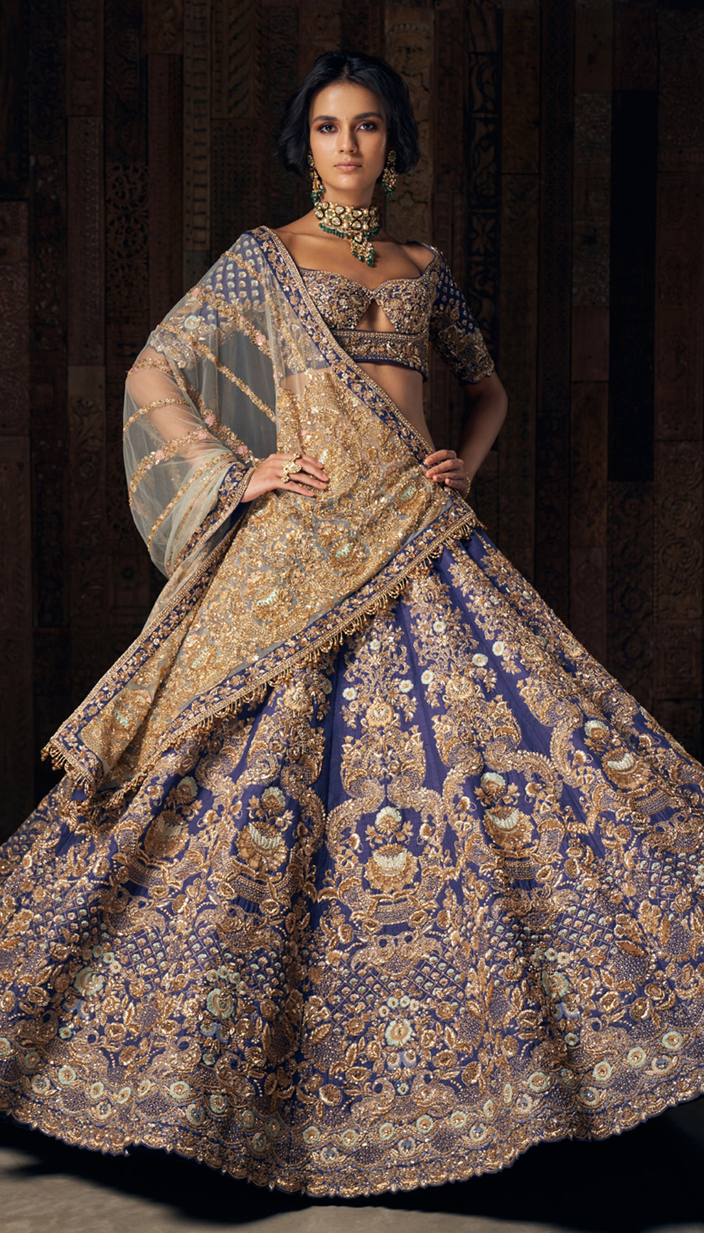 A majestic royal blue raw silk lehenga with exquisite zardozi and peeta embroidery,