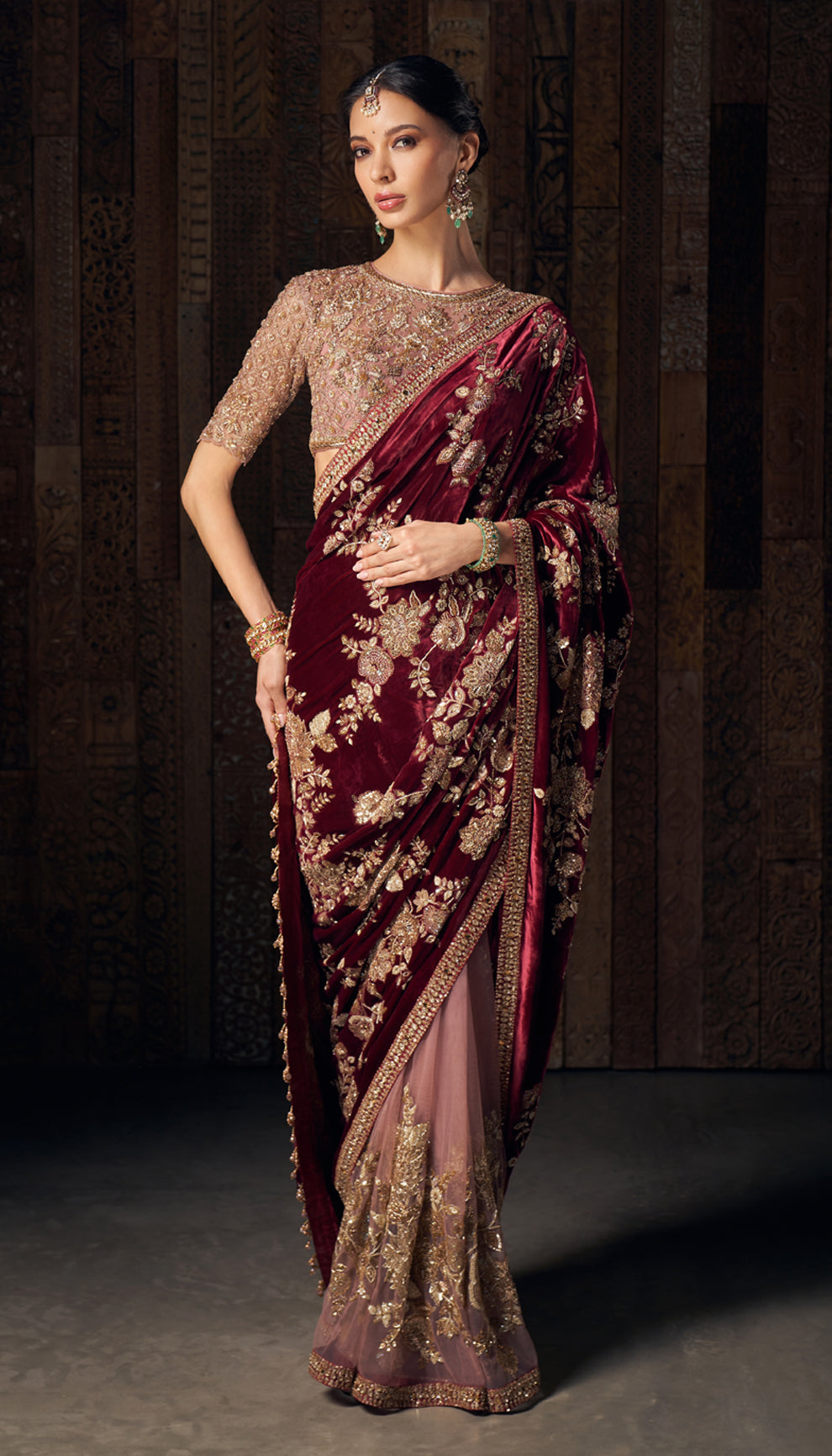 A resplendent wine velvet sari with opulent zardozi and peeta embroidery.