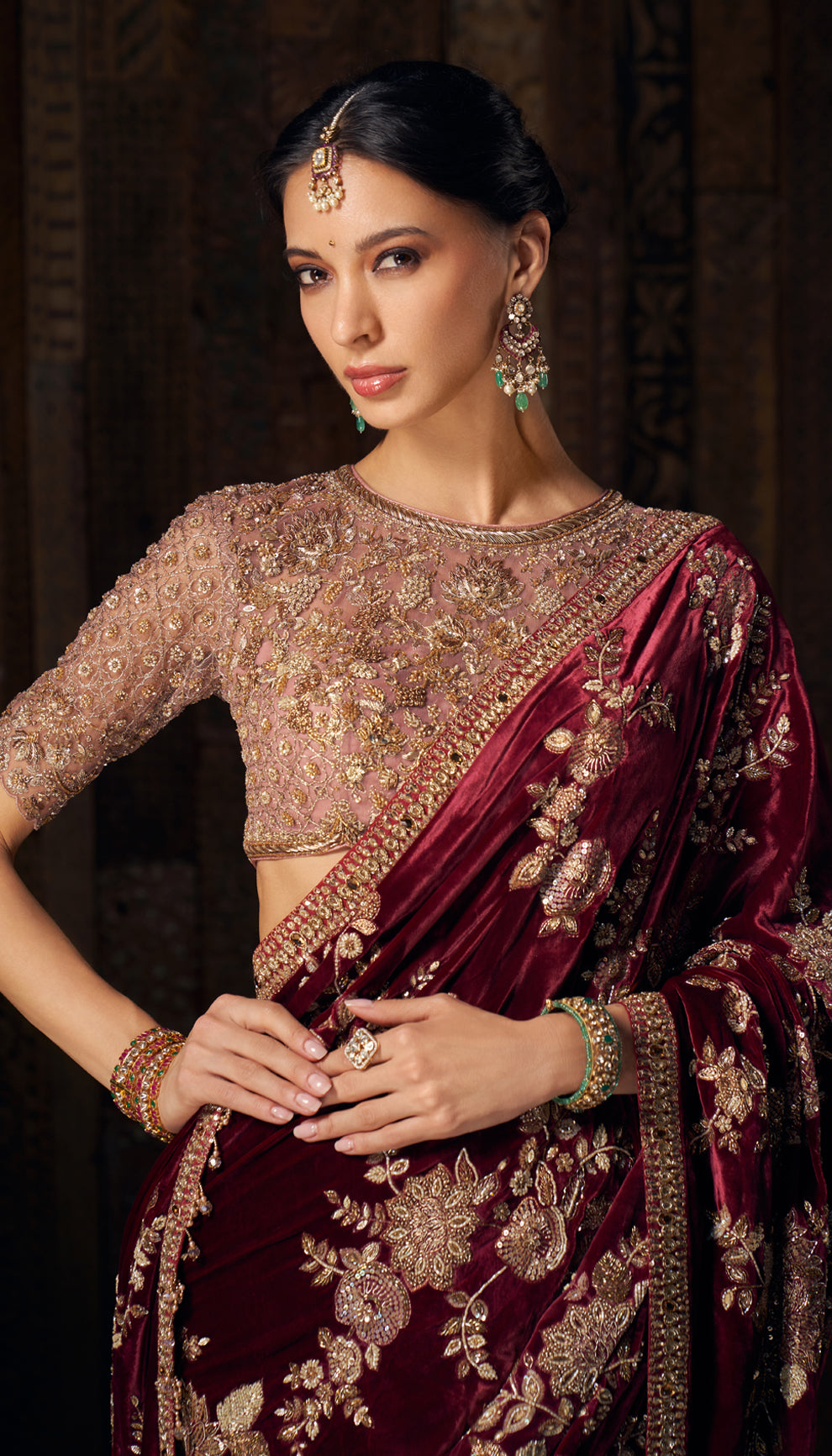 A resplendent wine velvet sari with opulent zardozi and peeta embroidery.